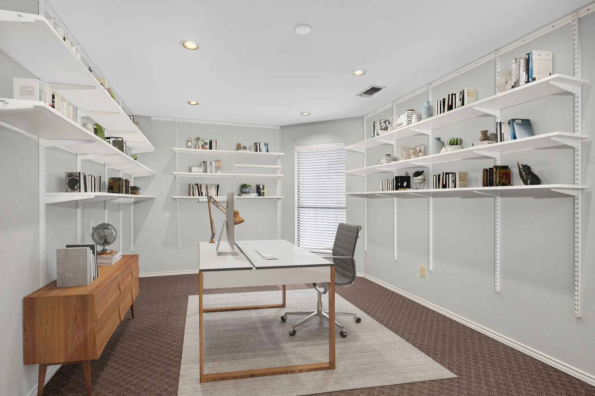 Two versatile flex spaces offer endless possibilities for a home office, hobby room, media room, game room, exercise space or additional living- one features extensive wall shelving ideal for an office, while the other is complete with built-ins & a wet bar, creating the perfect setting for impressive entertaining. The furniture and decor in this photo has been virtually staged, not altering the room.