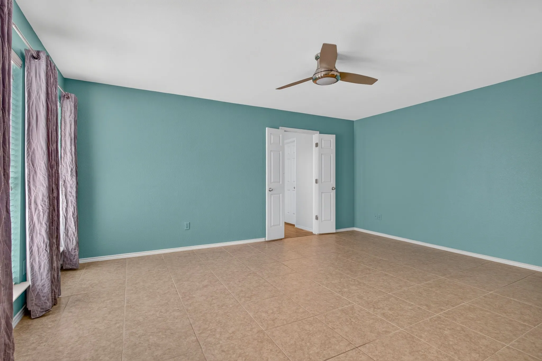 The spacious primary suite is a true retreat, featuring dual vanities, a seamless glass shower with bench seating, a jetted Hydrabath tub & an impressive 17x12 walk-in closet.