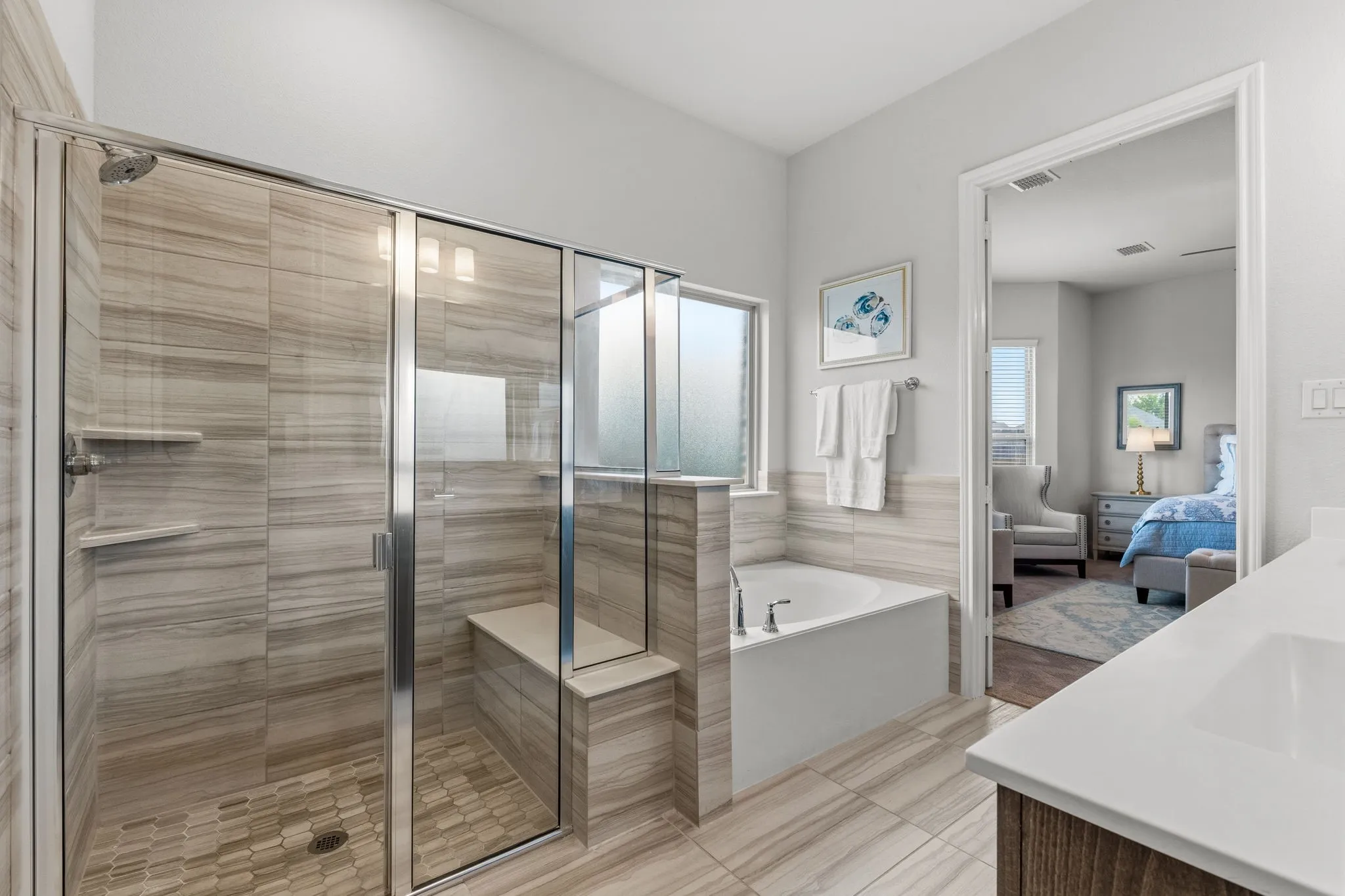 Primary Bathroom with bench seating in the shower