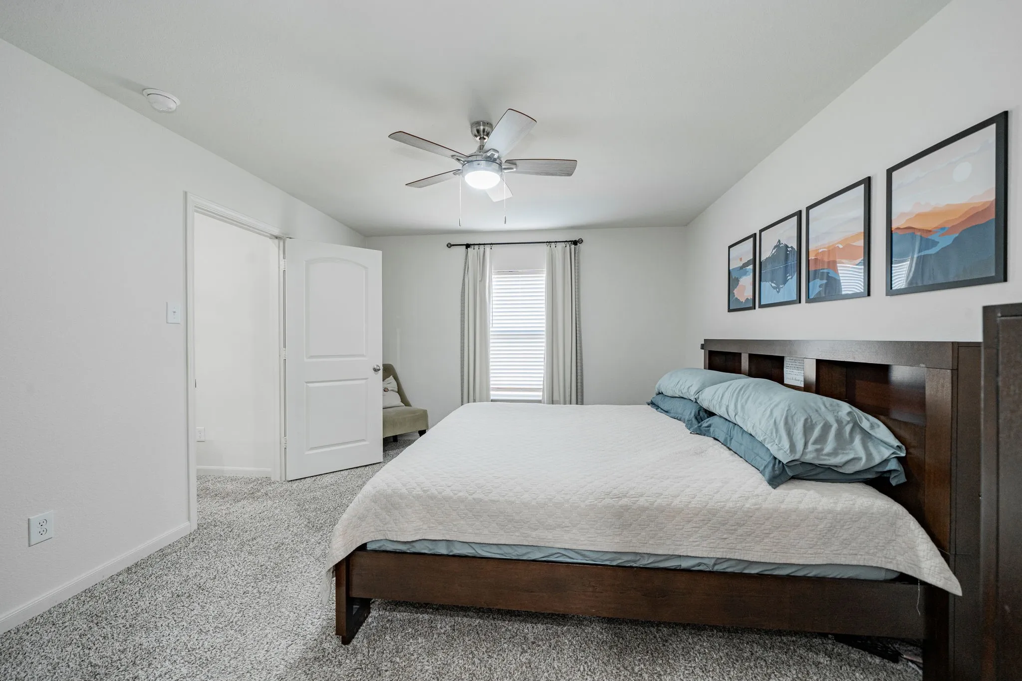 Spacious room featuring neutral carpeting and white walls