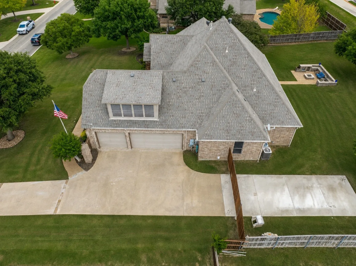 Brick exterior residence with a multi-gabled roof and a two-car garage