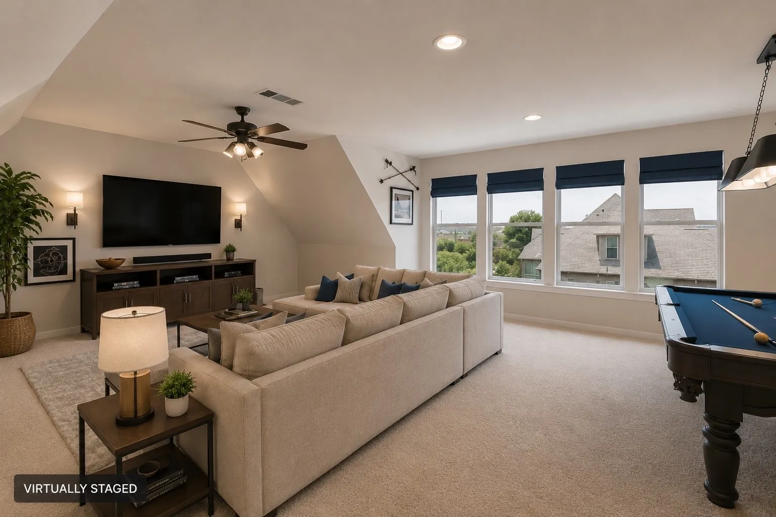 Spacious room with sloped ceilings, recessed lighting, and carpet flooring