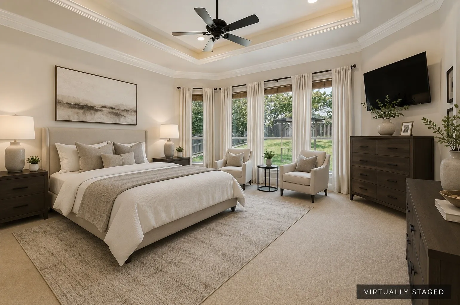 Tray ceiling with crown molding, ceiling fan, expansive windows, carpeted flooring, and recessed lighting
