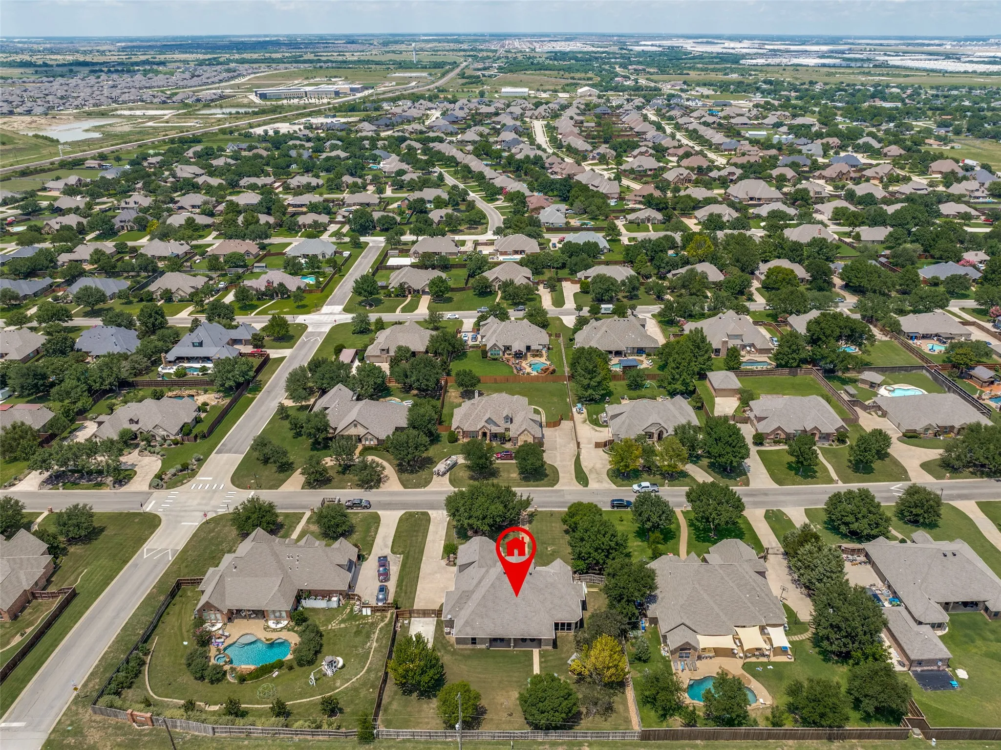 Aerial perspective of a residential neighborhood featuring established homes with varied architectural styles