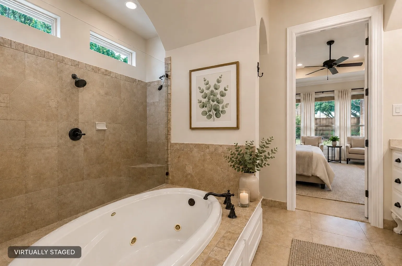 Soaking tub with bronze fixtures, tiled surround, and integrated cabinetry