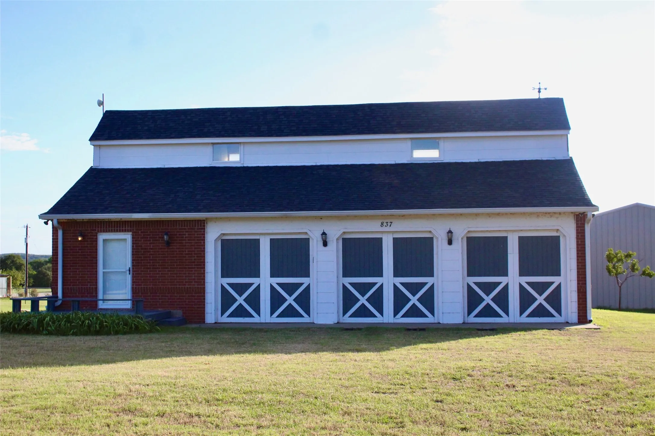 Front view with 3 car garage