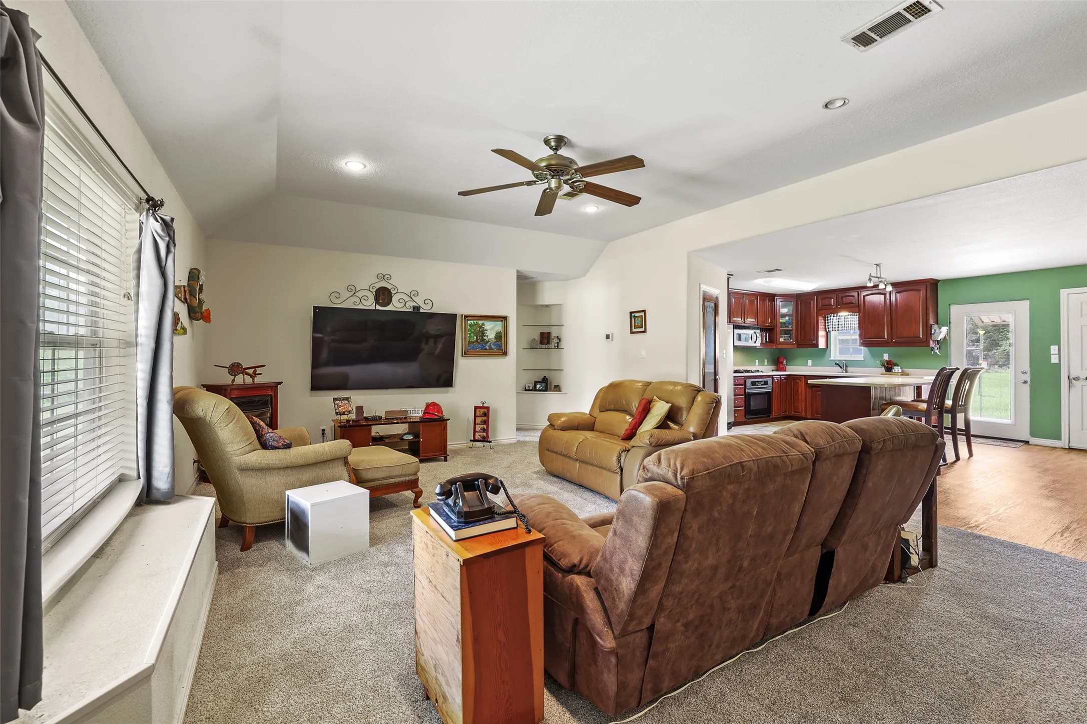 Open concept living area opens to the kitchen and dining areas