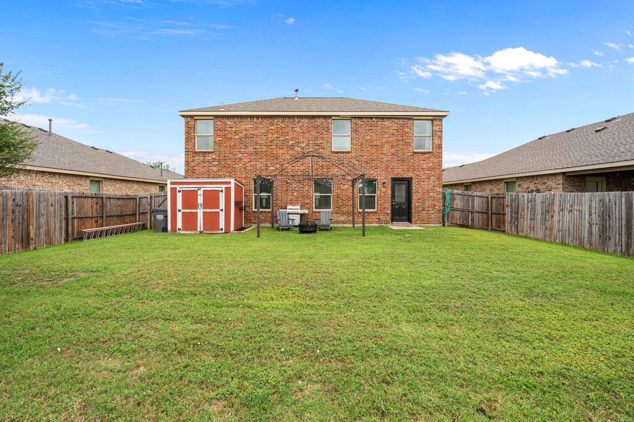 Huge back yard with utility shed.