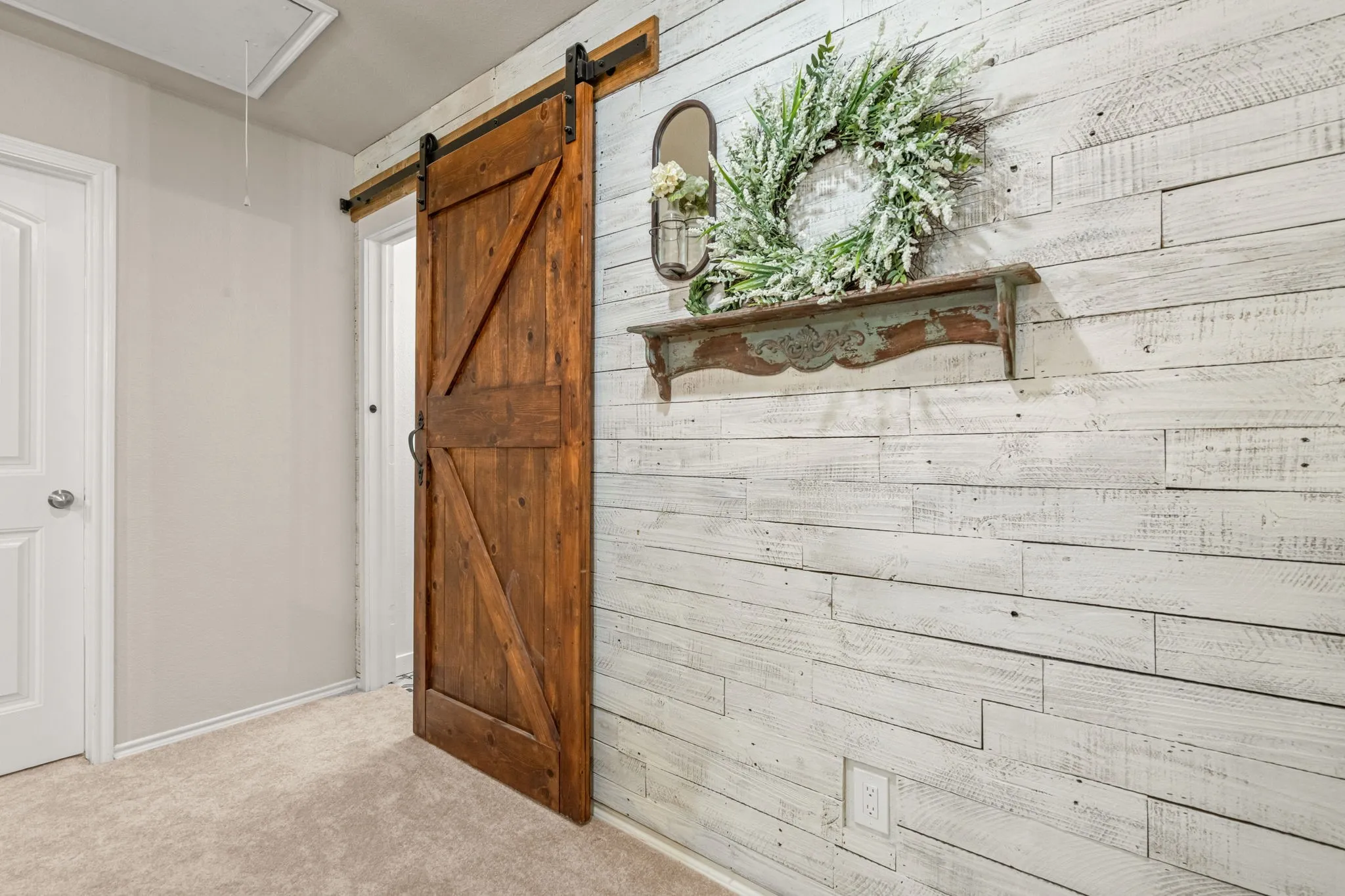 Decorative barn door to upstairs bath