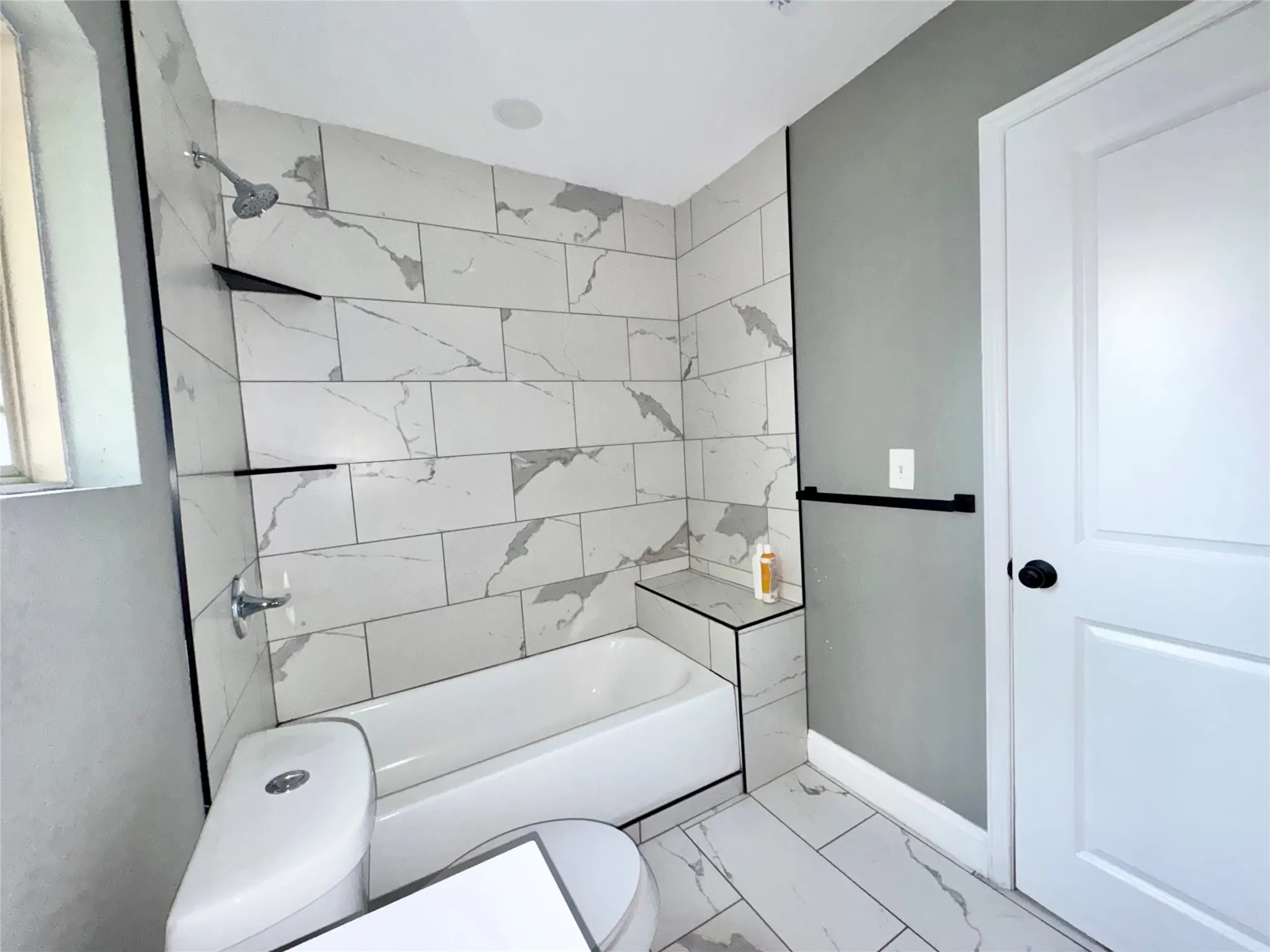 bath layout featuring luxury vinyl plank floors and new interior paint.