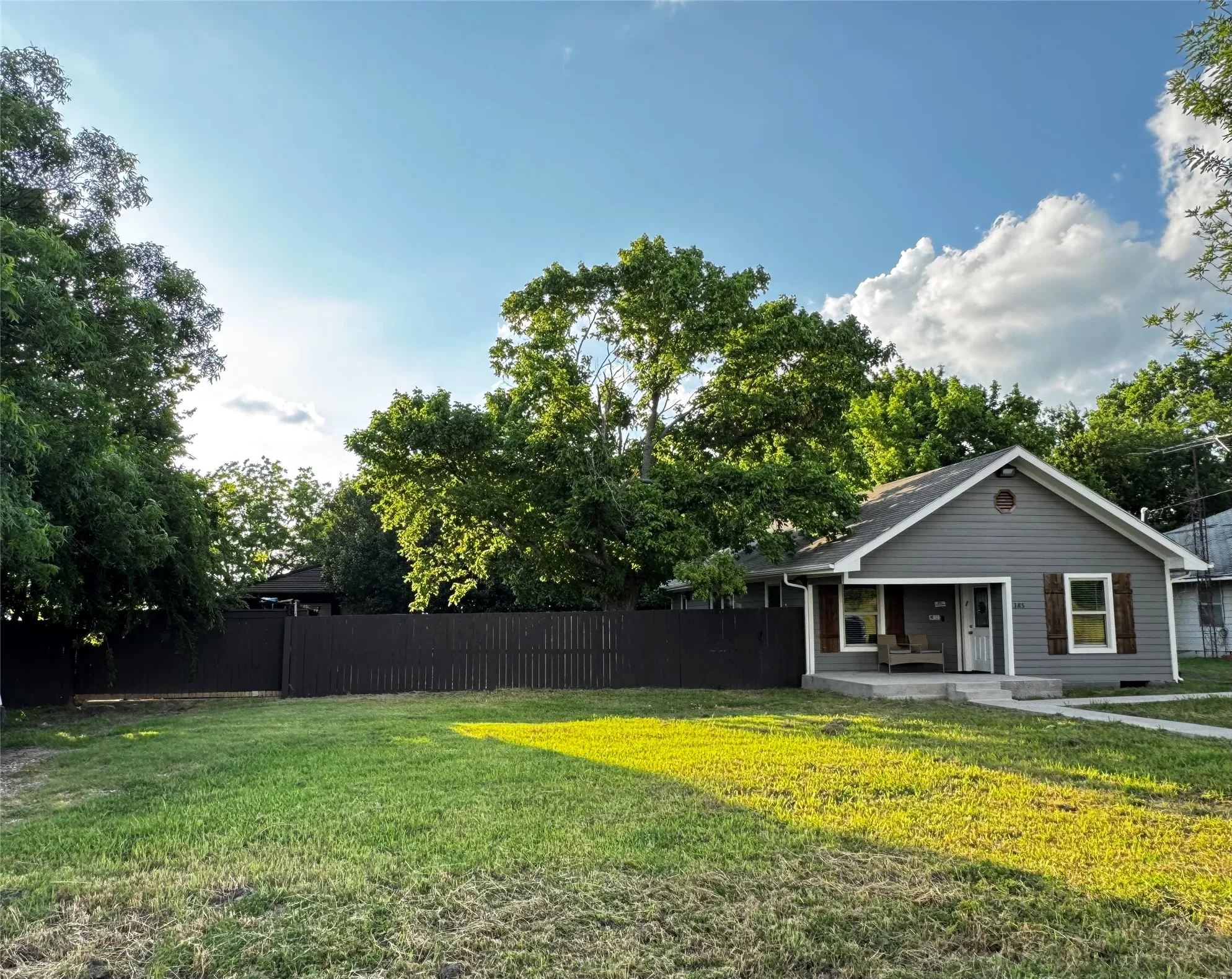 A 0.33-acre lot with no HOA, featuring a wide front sliding entry gate for property access.