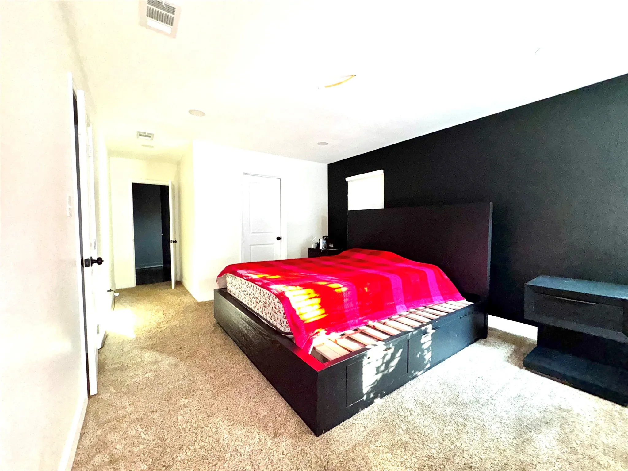 Spacious primary suite with lots of windows for natural lighting and surrounding field views.