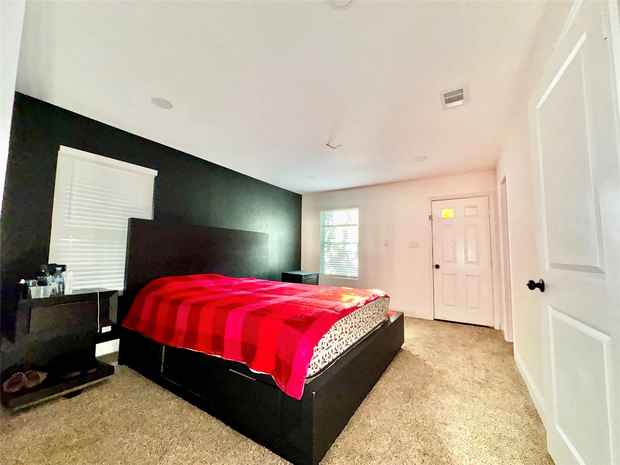Spacious primary suite with lots of windows for natural lighting and surrounding field views.