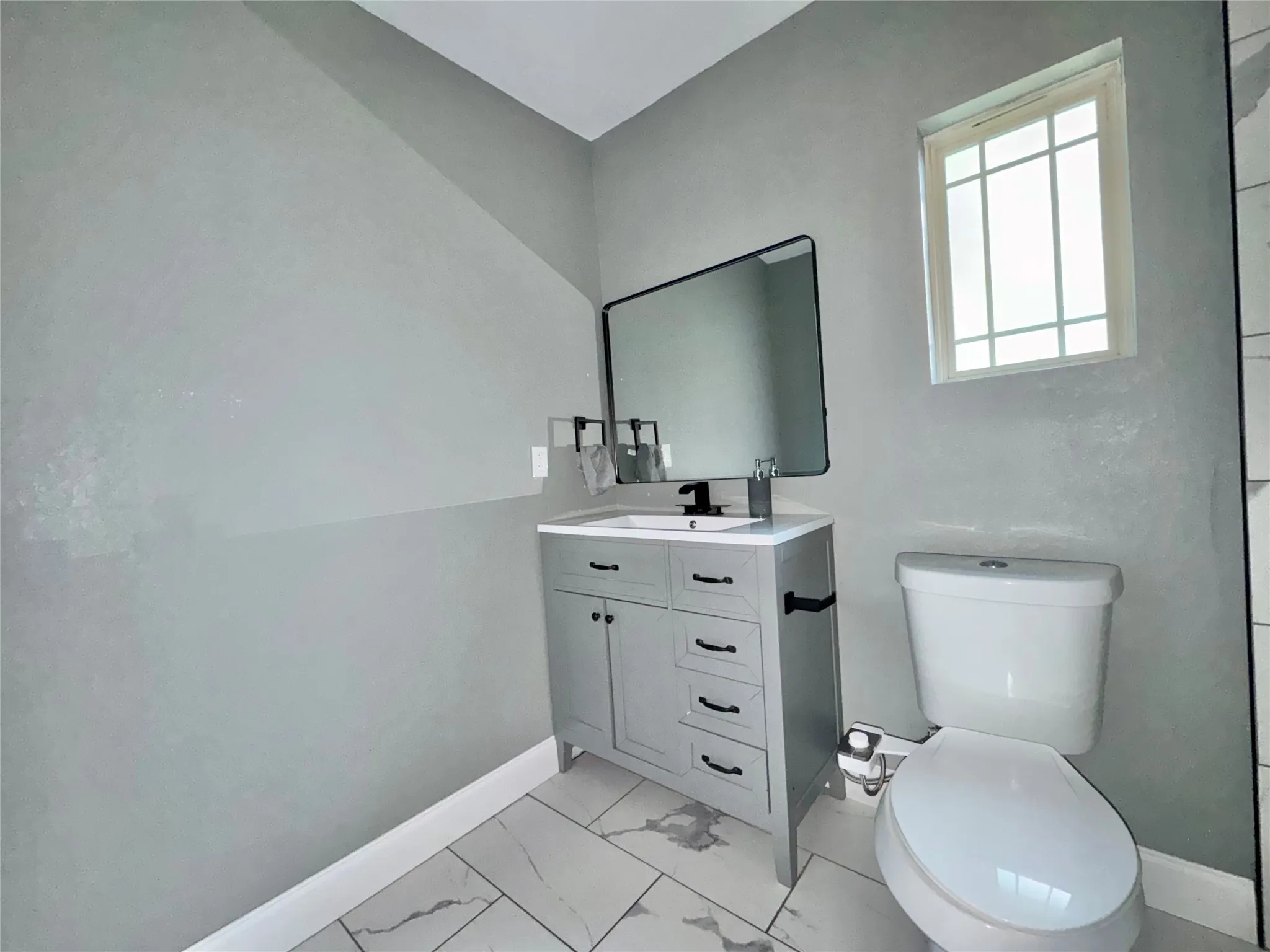 ull-sized secondary bathroom with luxury vinyl plank flooring serving the guest bedrooms