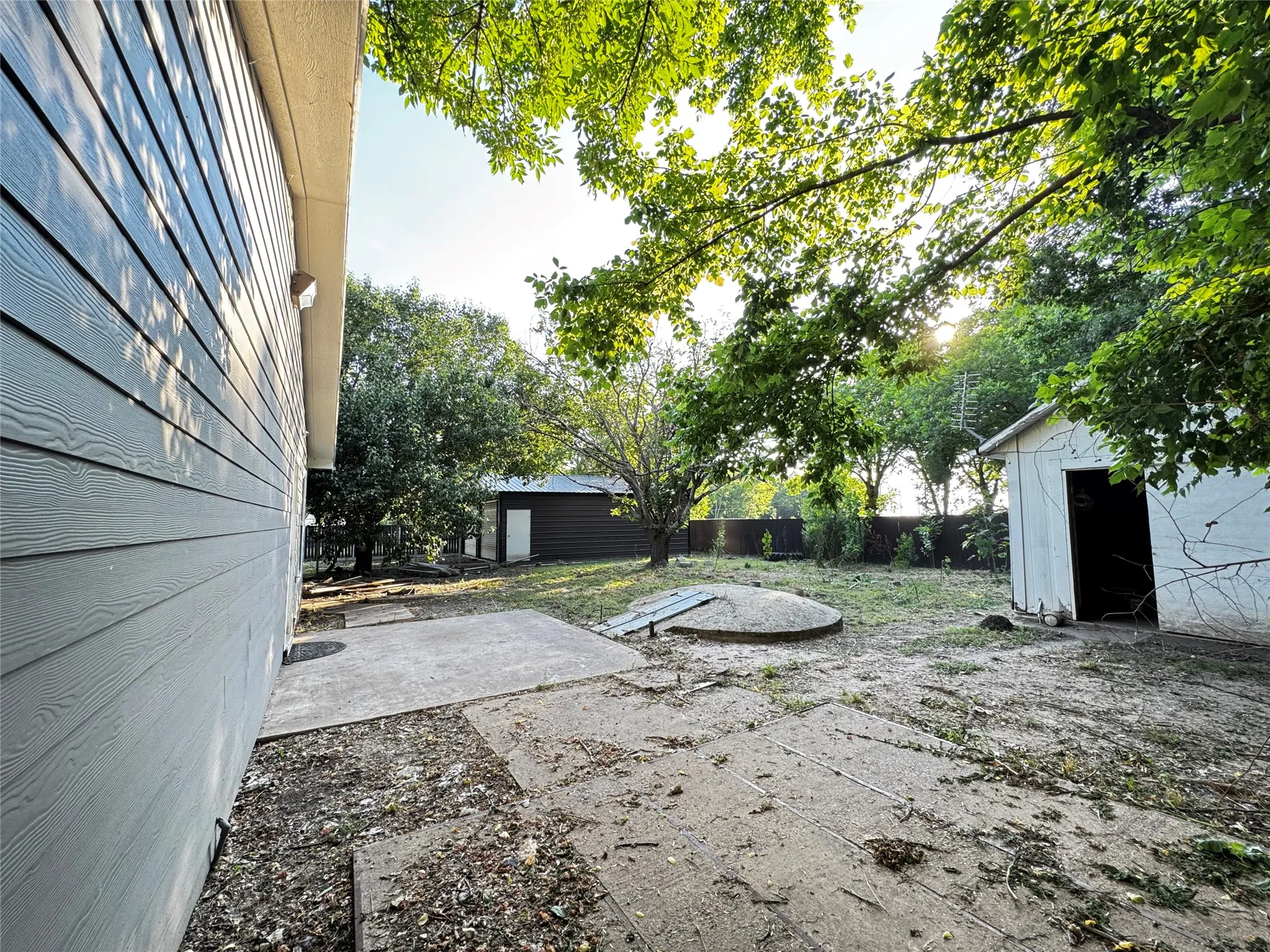  On-site storm shelter structure located within the fenced property grounds.