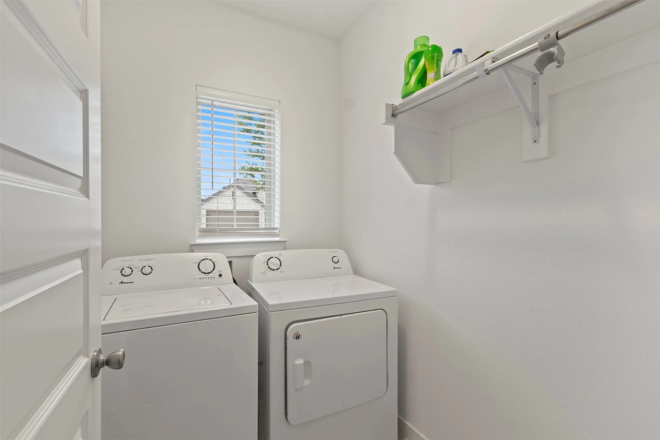 Laundry room with washing machine and clothes dryer