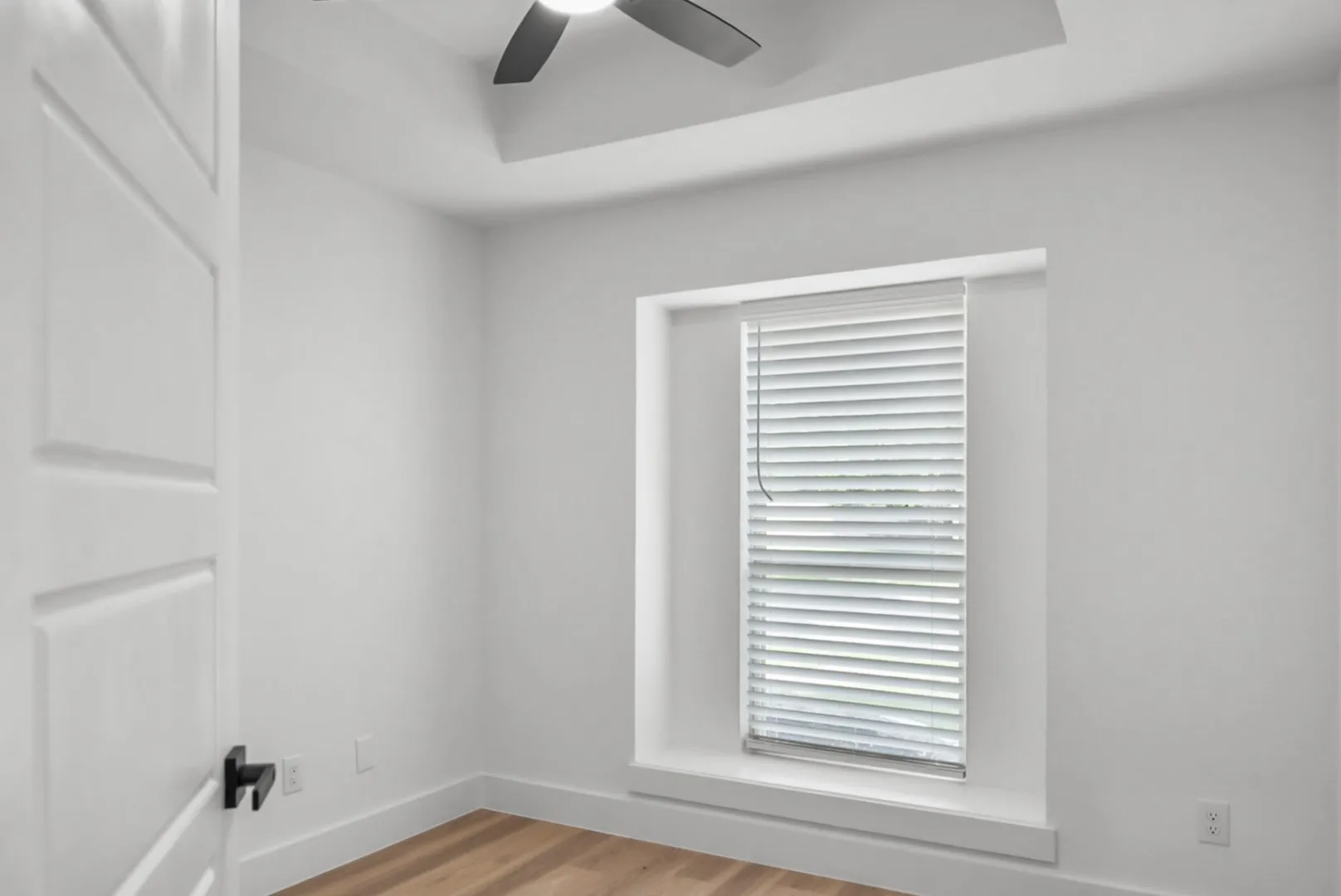 Crisp white interior with wood-finish flooring