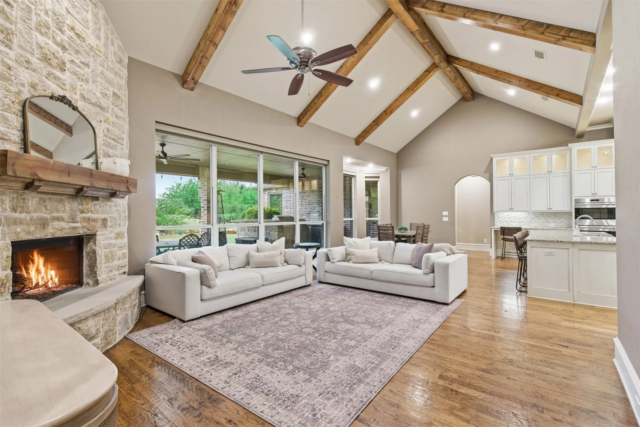 Vaulted ceiling with wood beams and recessed lighting