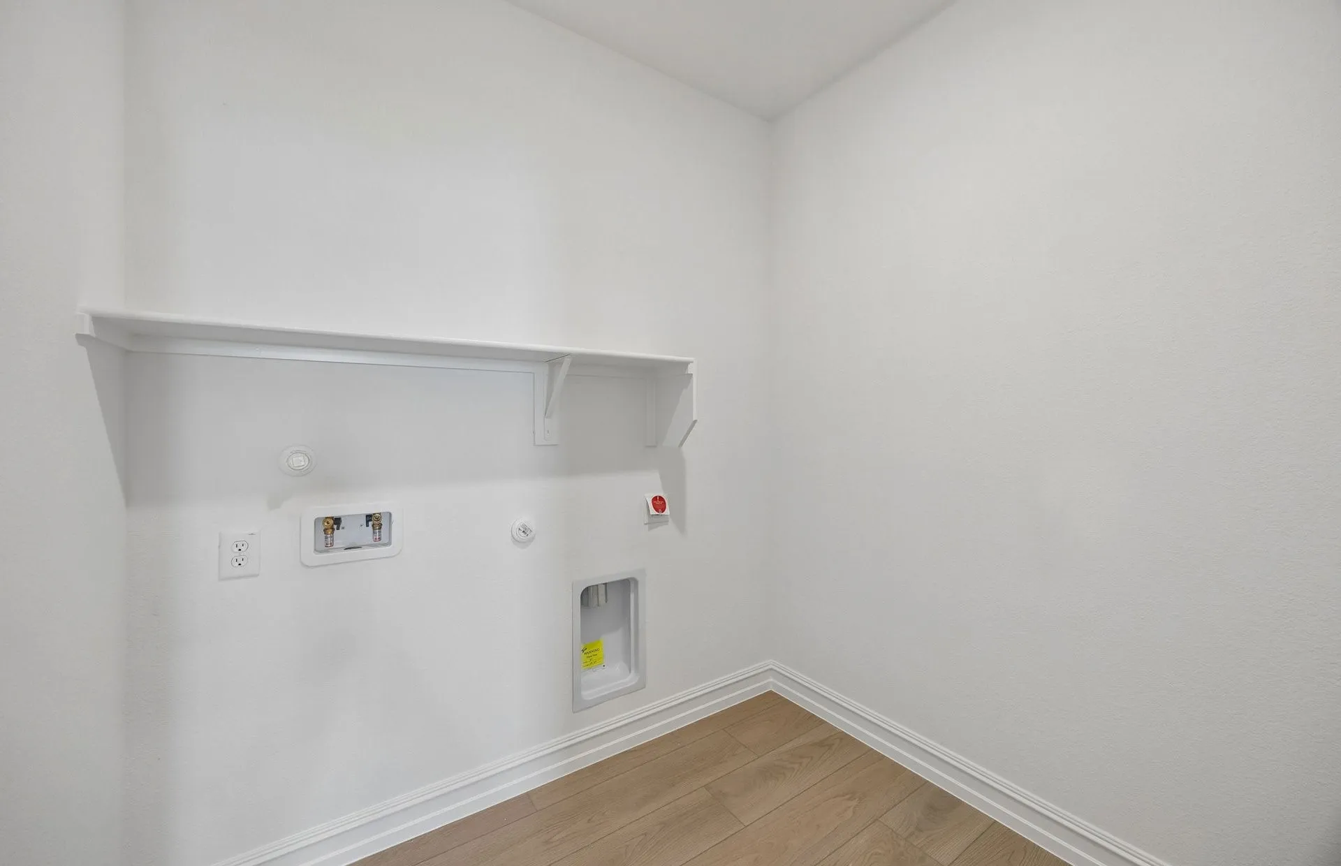 Laundry rom with built-in shelving