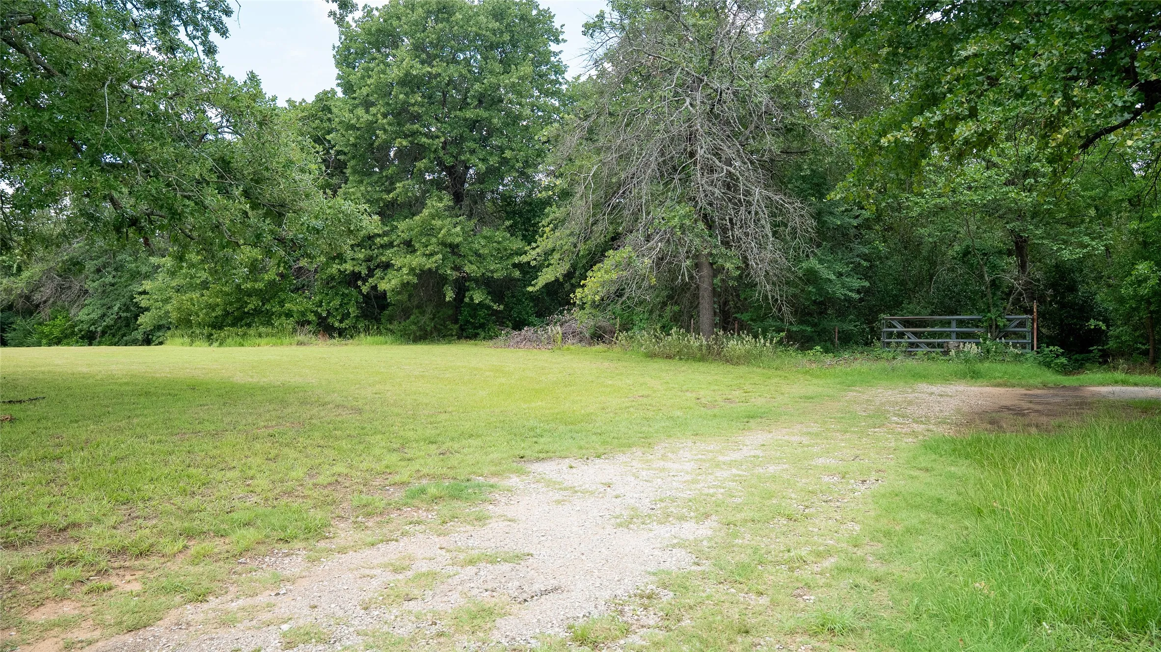 The Trail into the Property is East of the Gate
