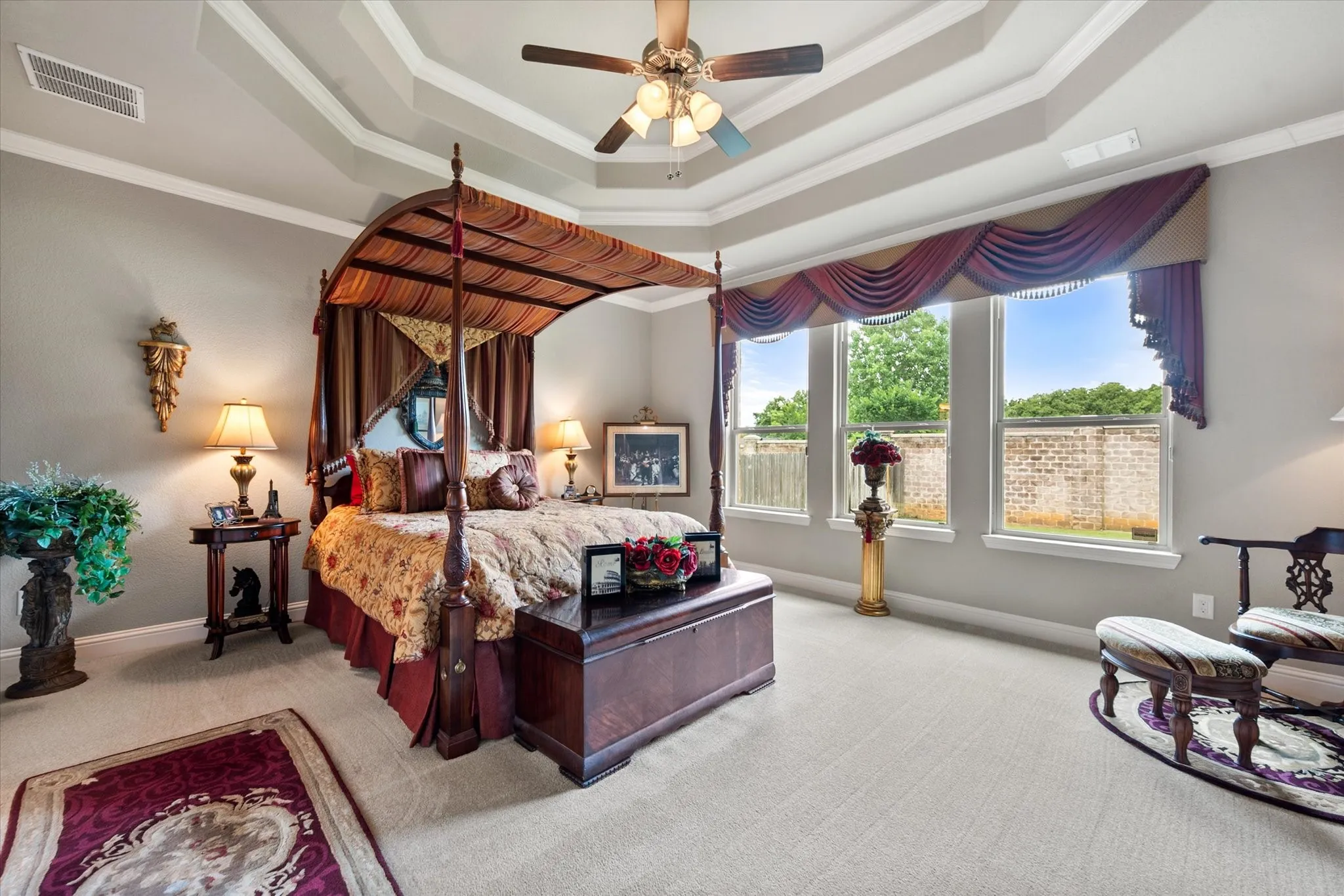Primary bedroom has recently replaced carpet, double trey ceiling and plenty of room for all your furniture.
