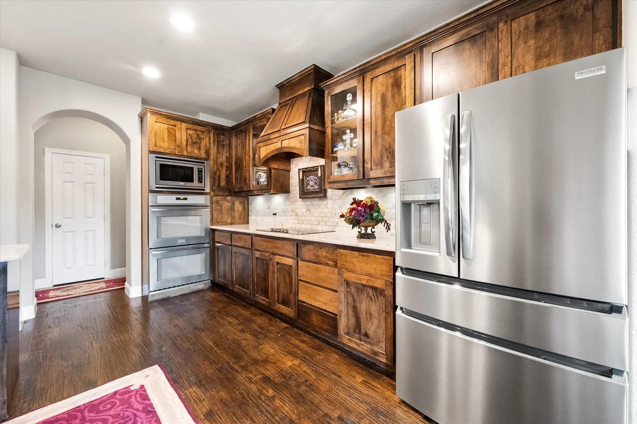 Double oven and stainless appliances.