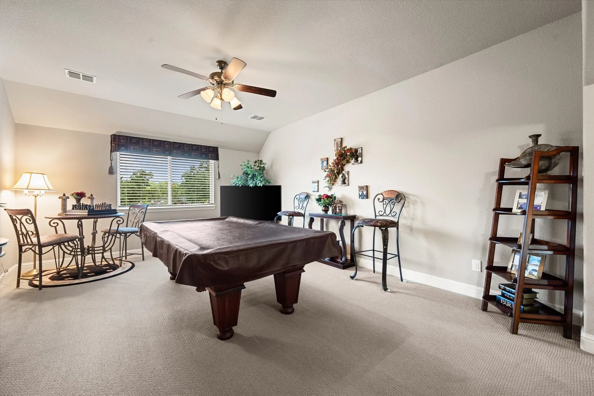 Upstairs game room or great room. Pool table and ping-pong table top stays.
