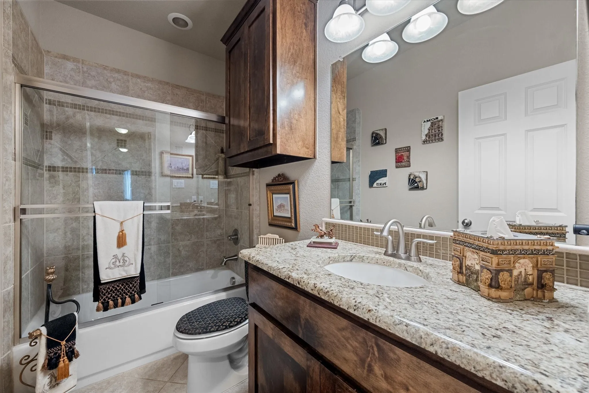The downstairs full bath is just outside the second bedroom.