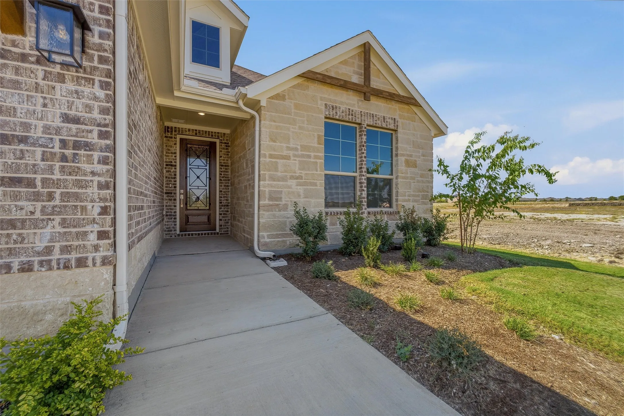 Brick and stone exterior with decorative timber accents