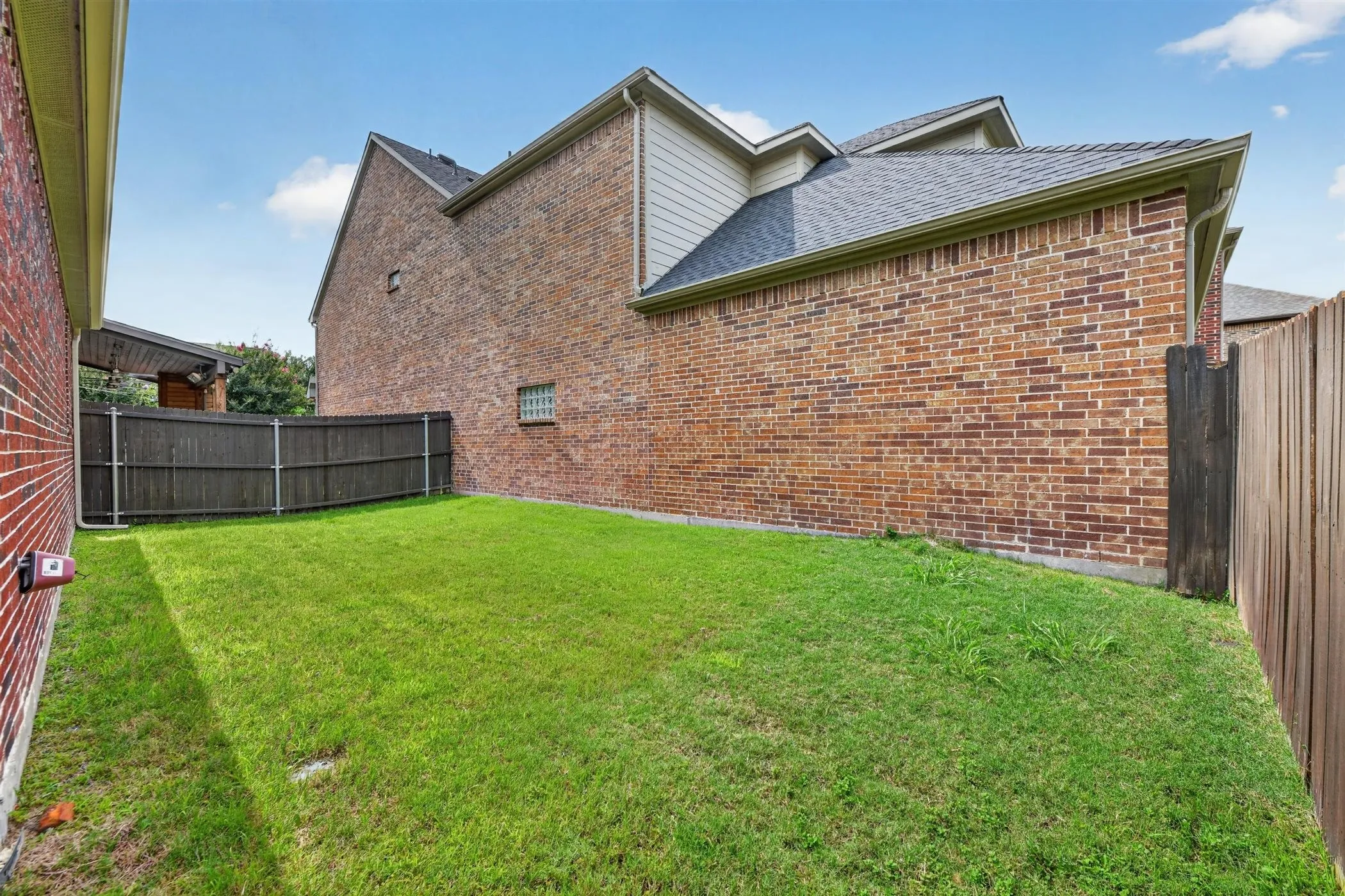 Large grassy back yard
