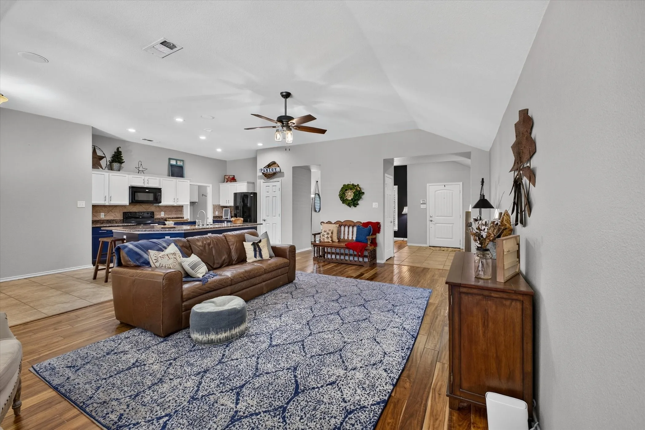 Spacious open concept living room with engineered hardwood floors