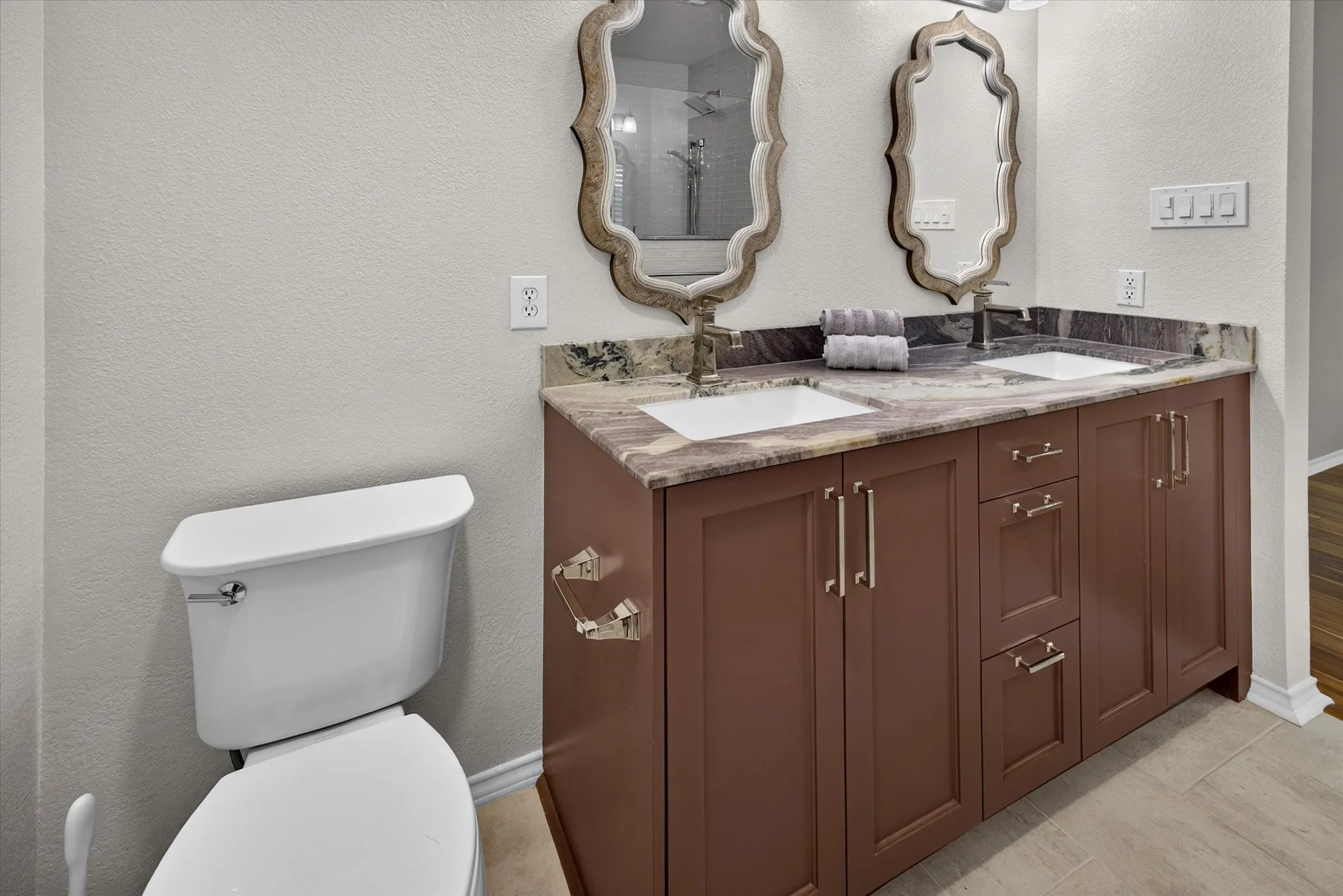 Recently renovated custom vanity with quartzite countertops