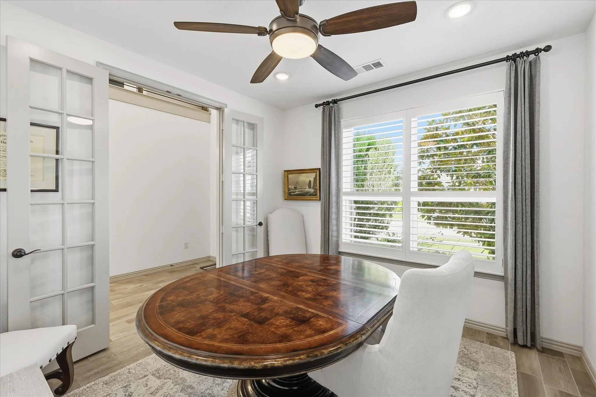 Home office with French doors upon entry.
