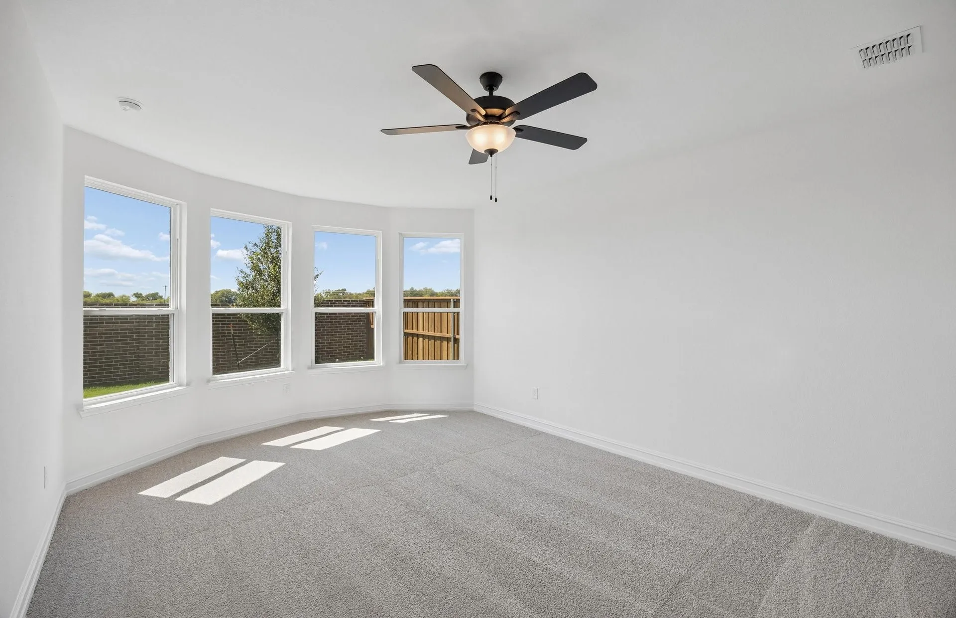 Primary bedroom with bay windows