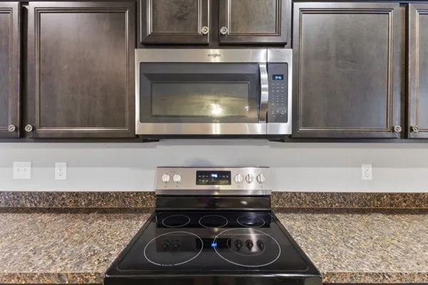 Cooktop with overhead microwave