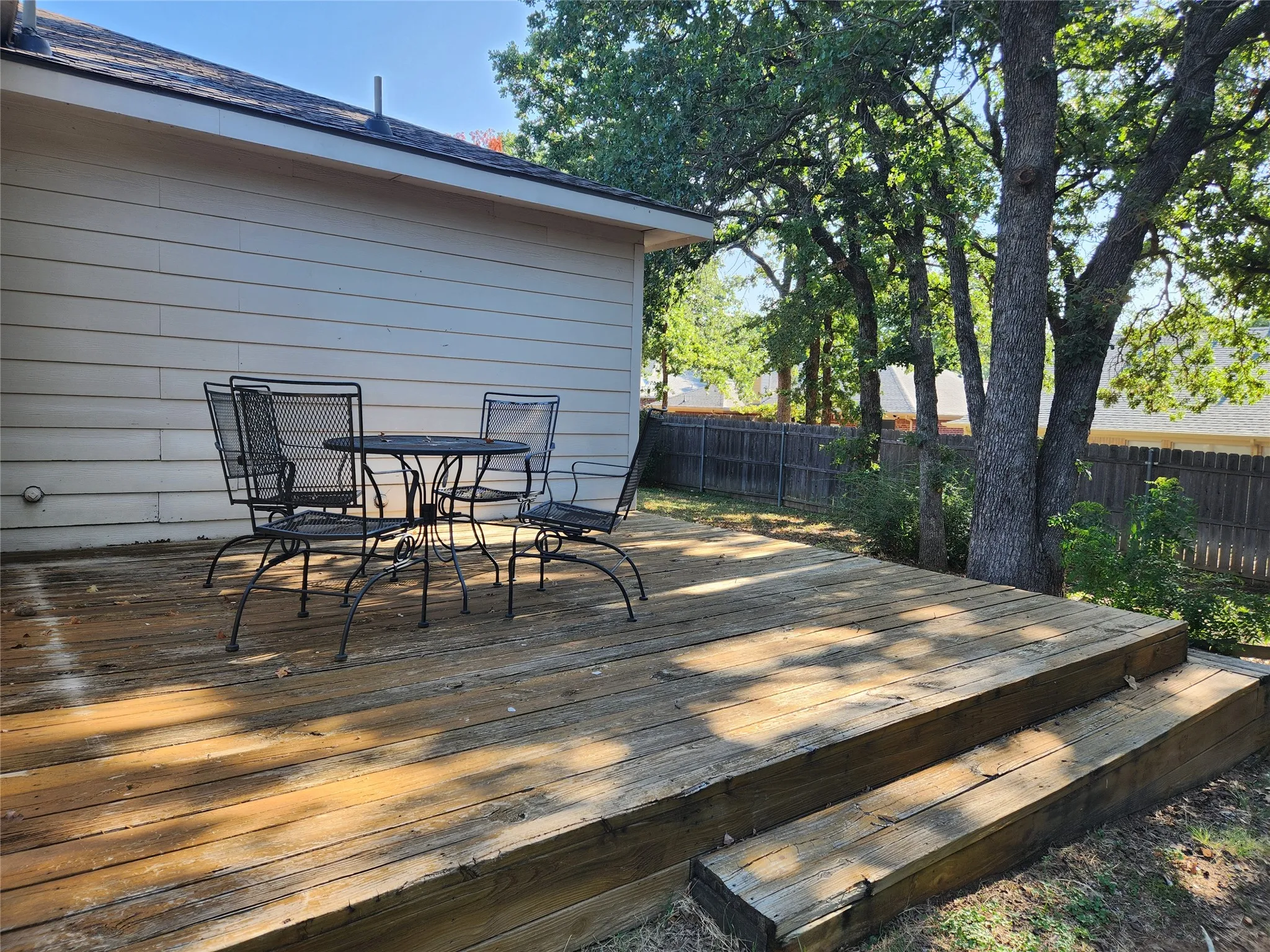 Large deck gets afternoon shade to enjoy the outdoors.  Patio furniture stays.