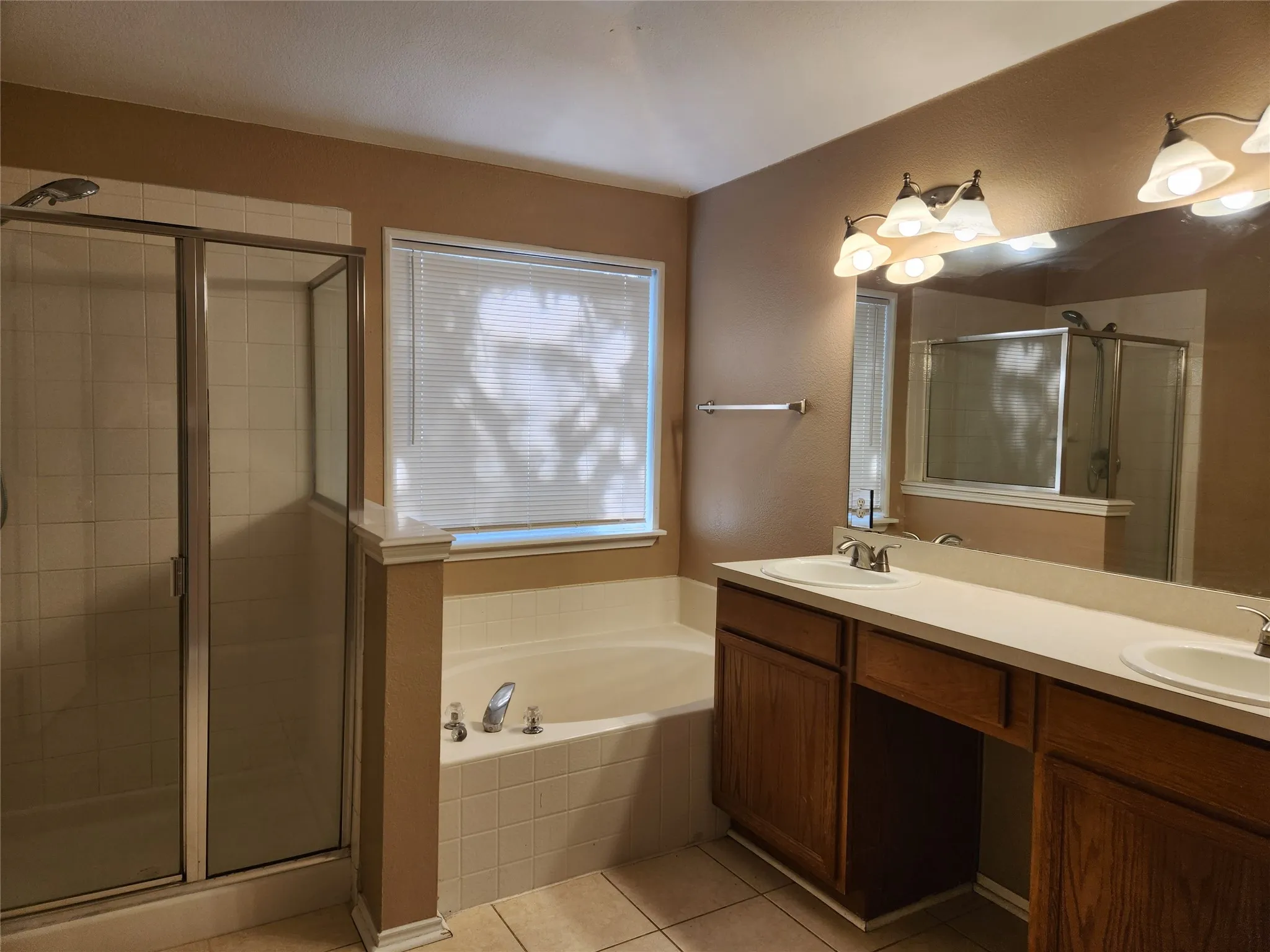 Primary bath has separate tub and shower