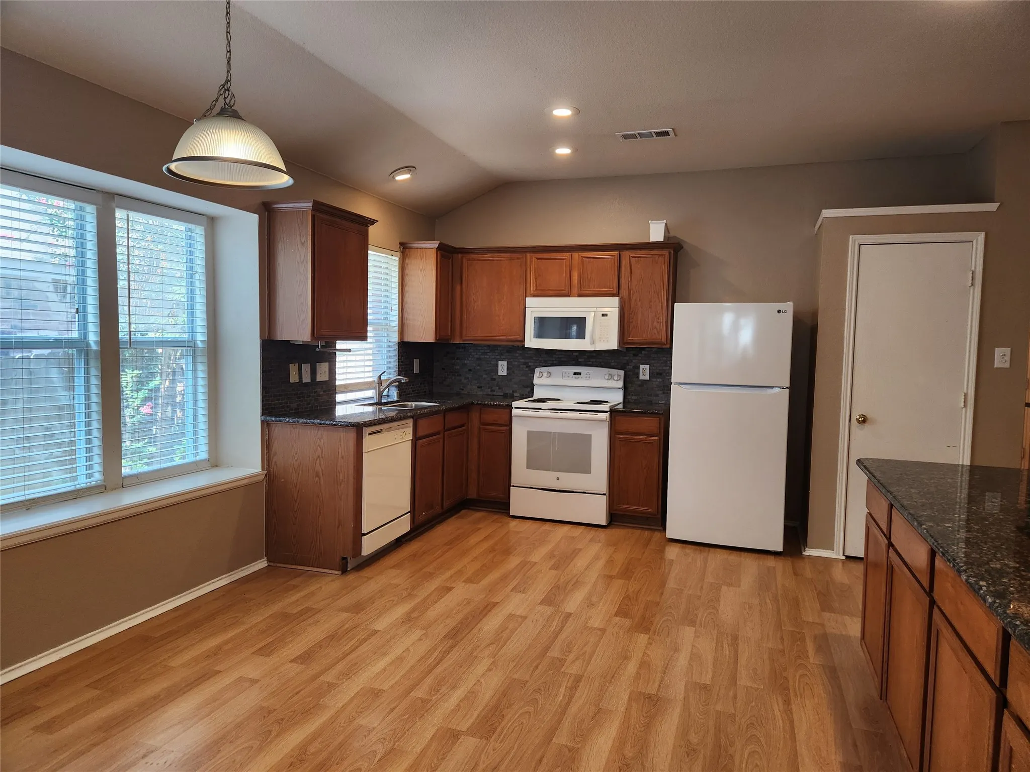 Kitchen has pantry in addition to lots of cabinet storage
