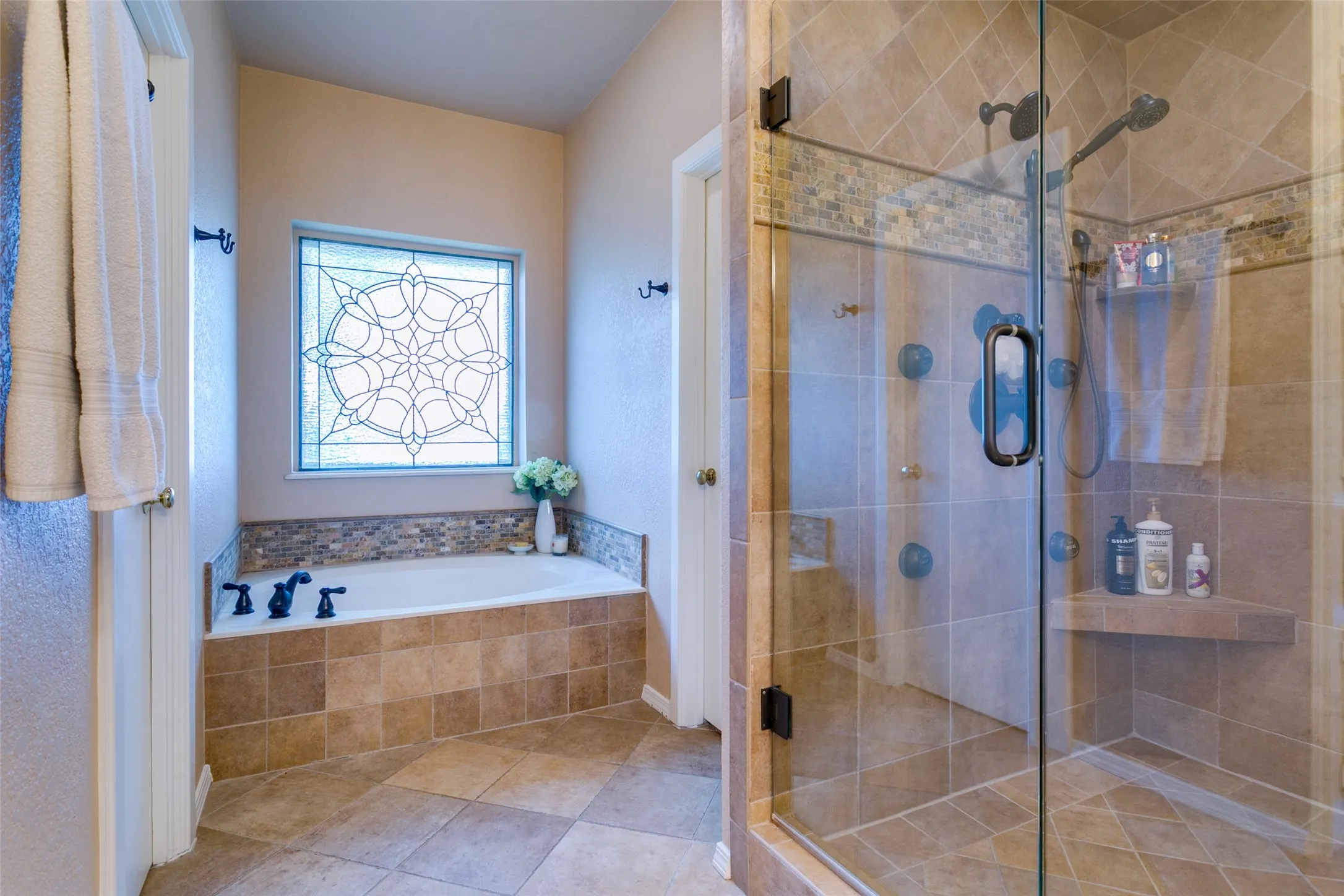 A spa-like bath with a jetted tub designed for relaxation