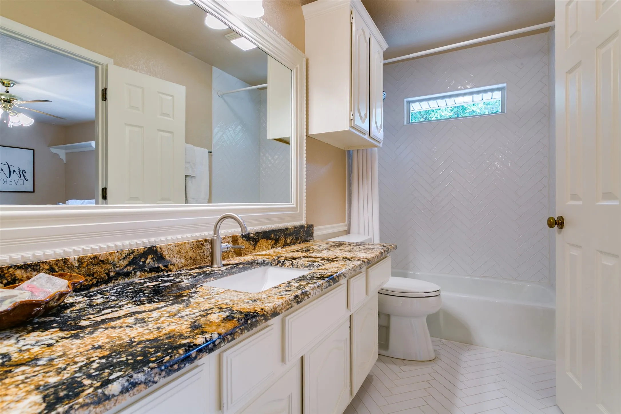 A full bath updated with fresh, timeless finishes