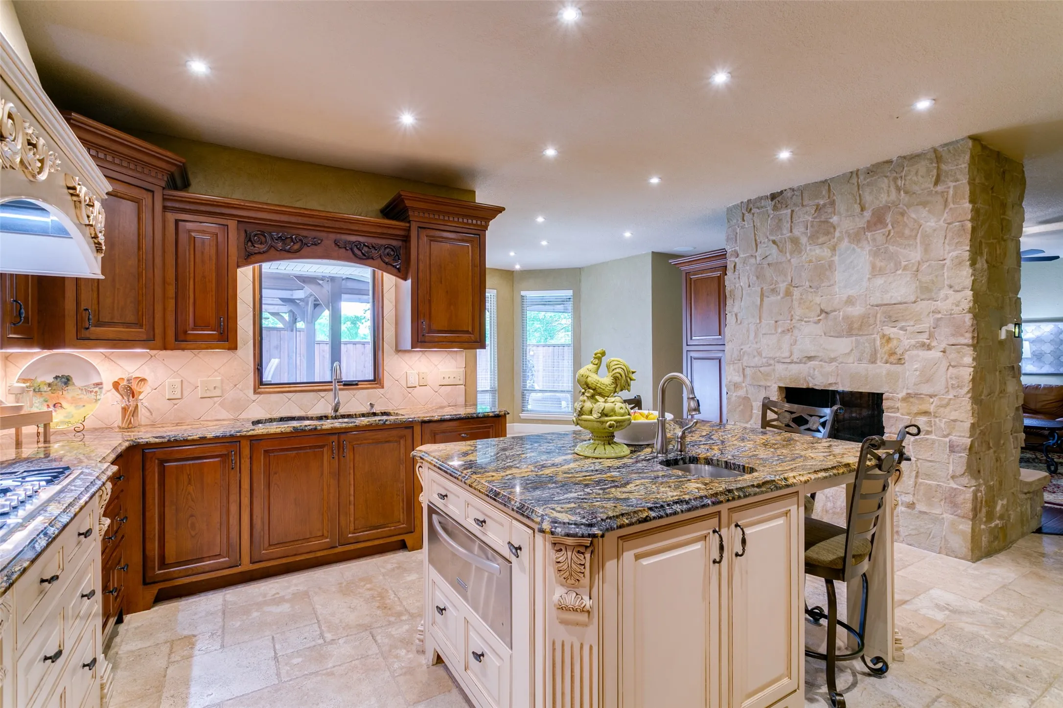 Granite countertops, abundant storage and a double-sided fireplace, adding warmth to both spaces
