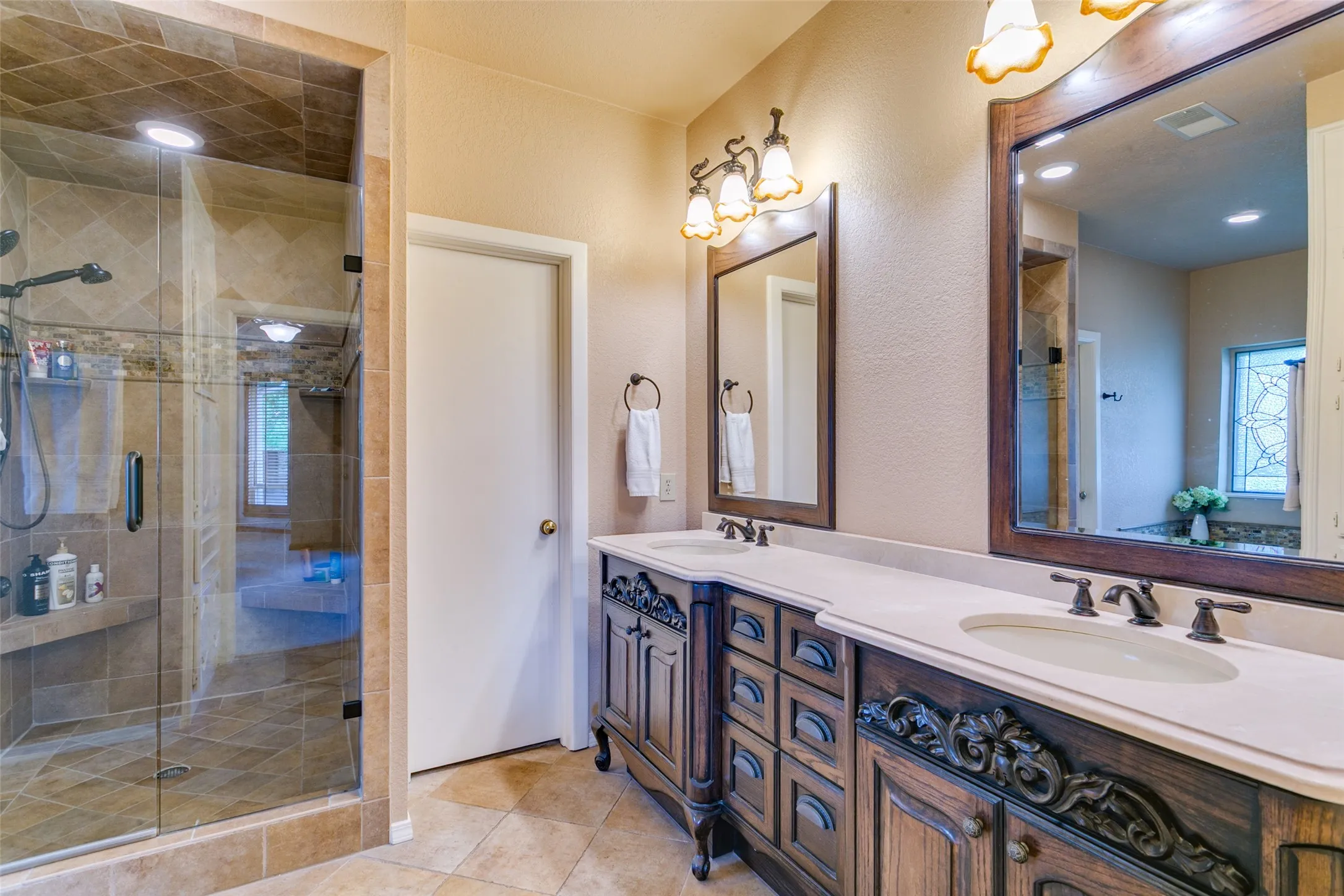 Dual vanities, double closets and a separate, walk-in shower