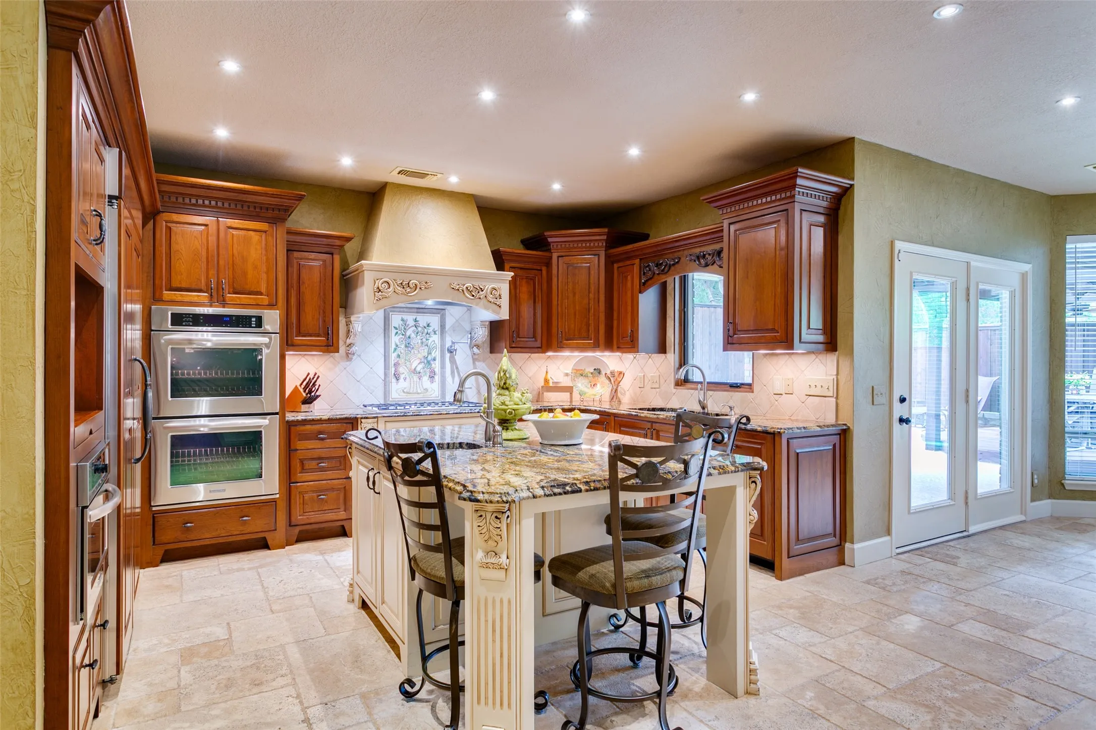 A cook's dream - double ovens, gas cooktop, pot-filler, warming drawer, built-in refrigerator and microwave