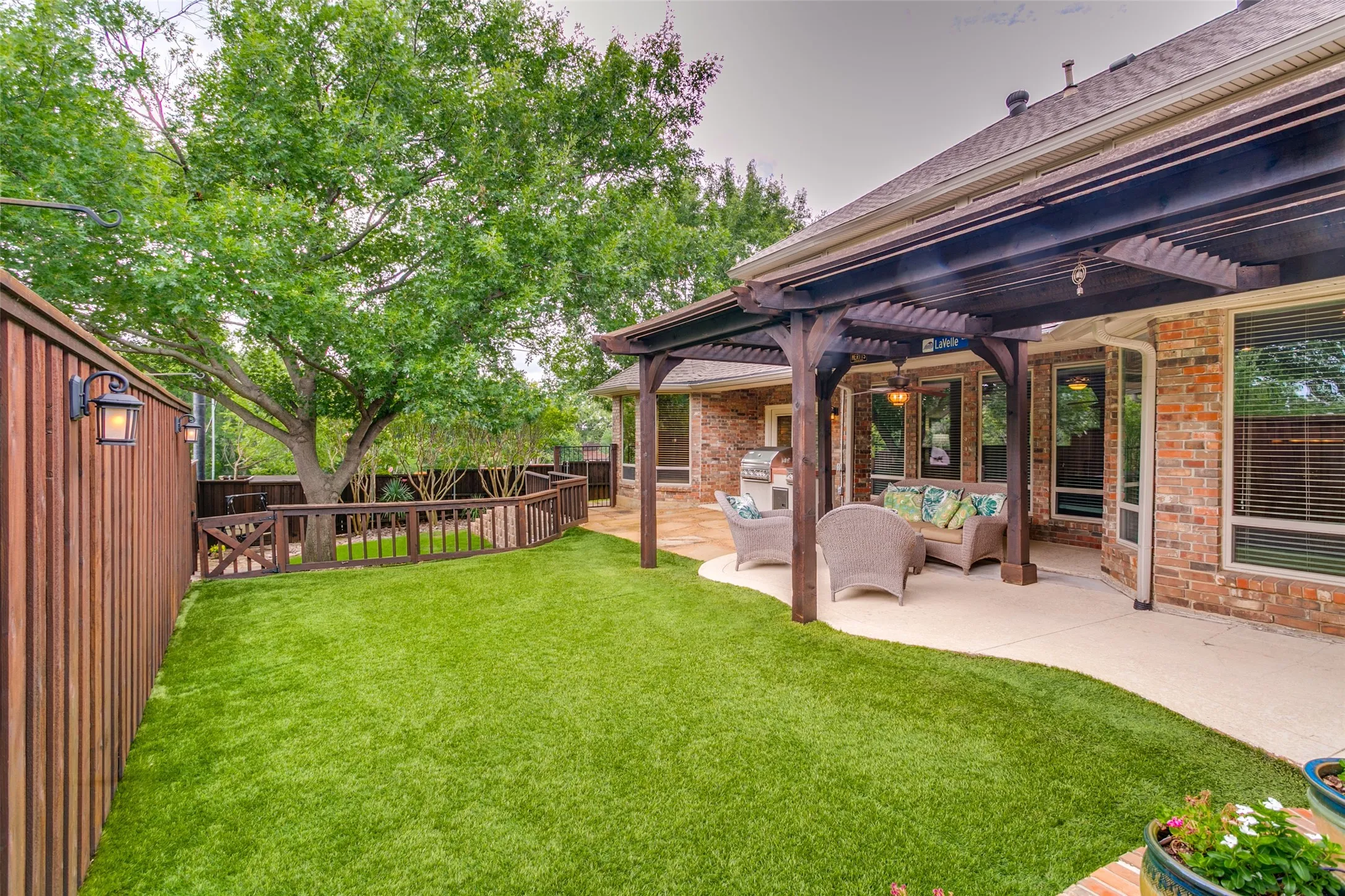 Low-maintenance artificial turf creates additional space for pets, play, or outdoor gatherings