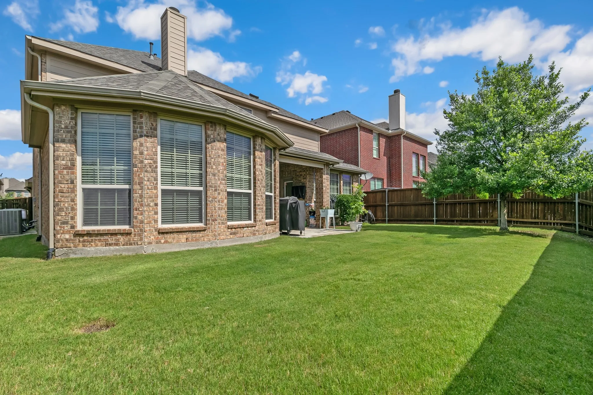 large grassy backyard with plenty of room for the kids, pets or gatherings.