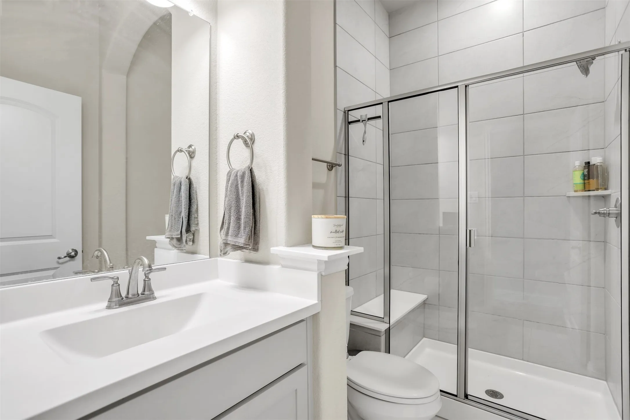 Bathroom with large tiled shower with built in bench