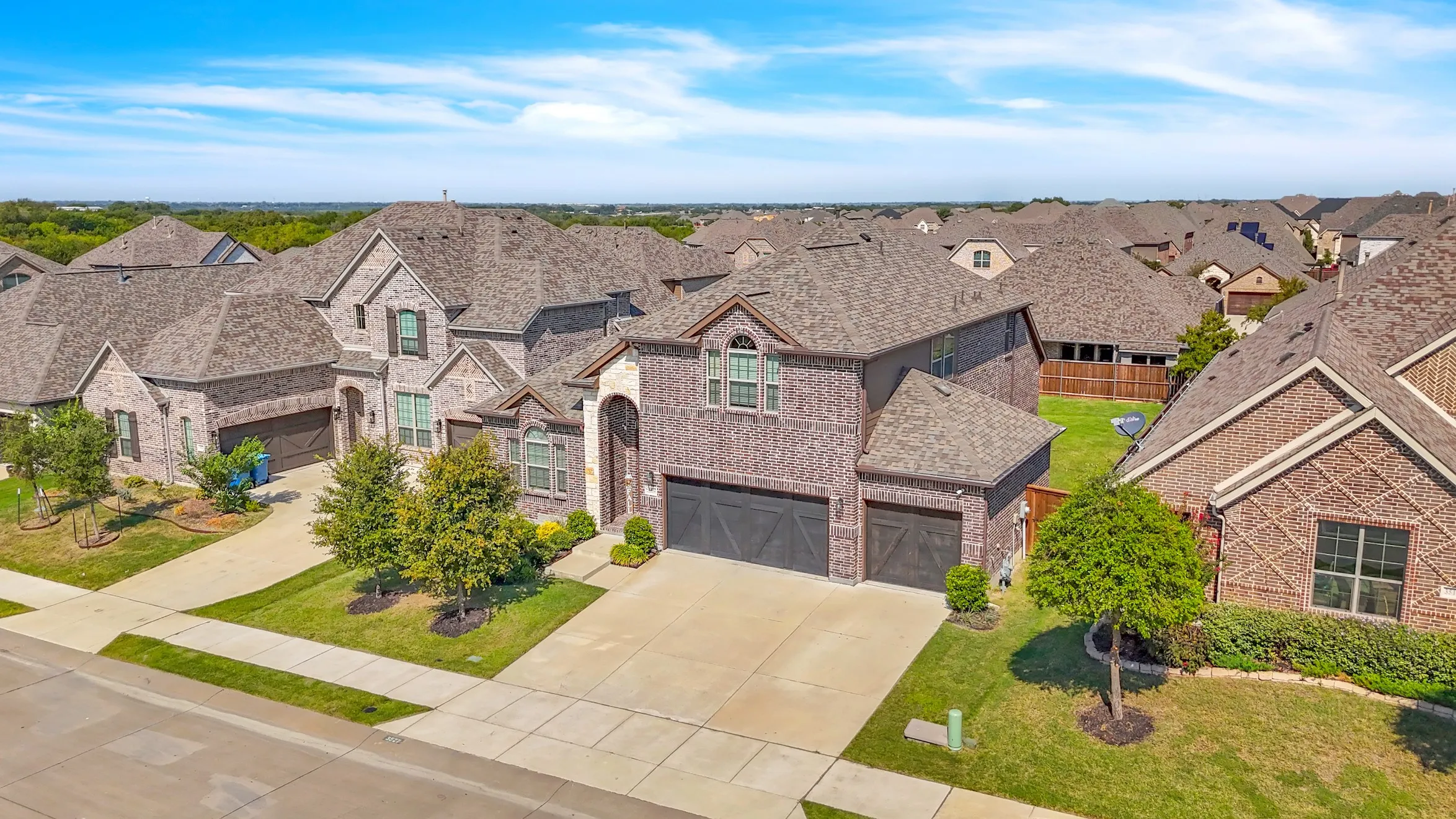 3 car garage with plenty of parking on the driveway