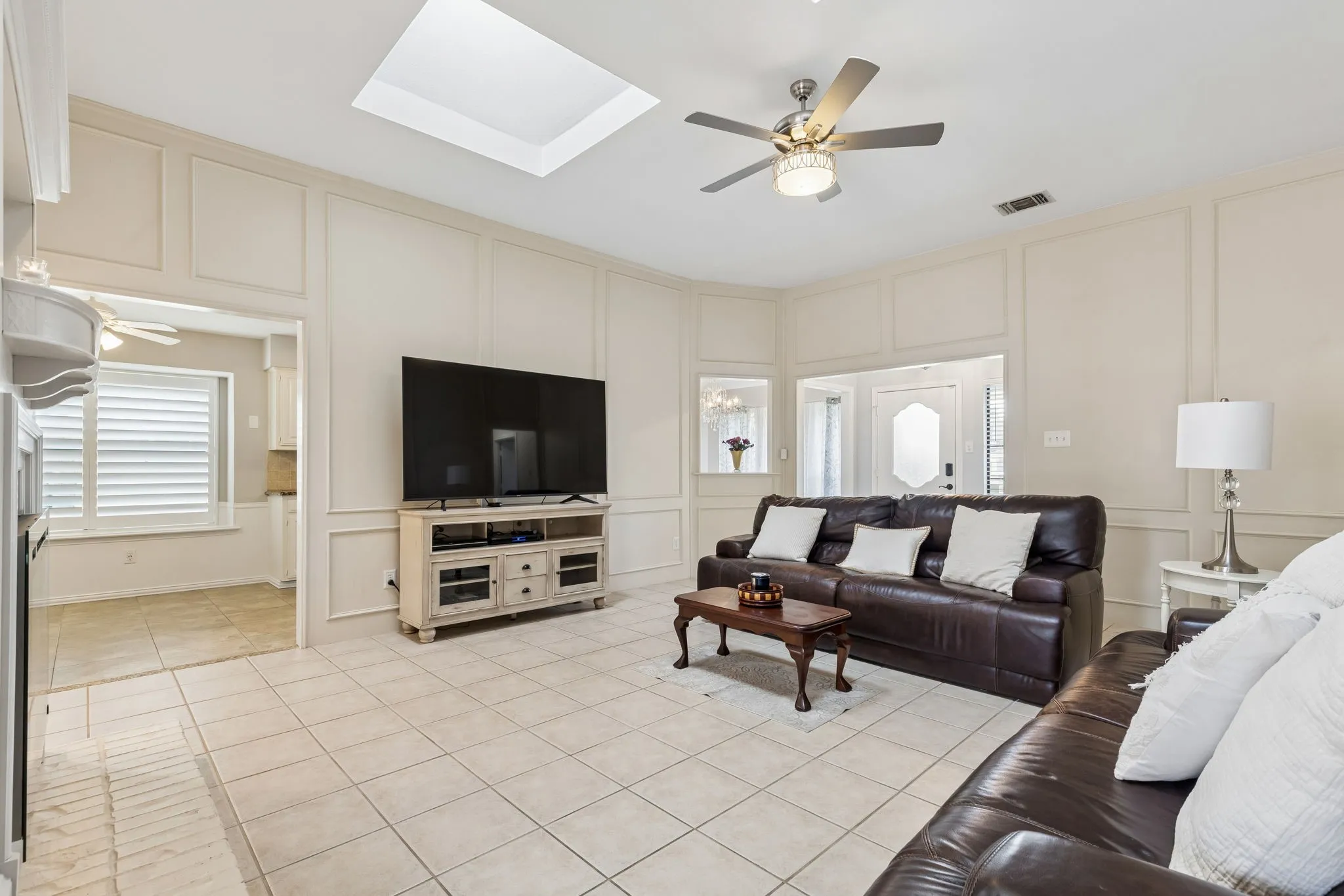 Large living area accomodates any size furniture and is open to the kitchen. Fireplace with remote and heat option.