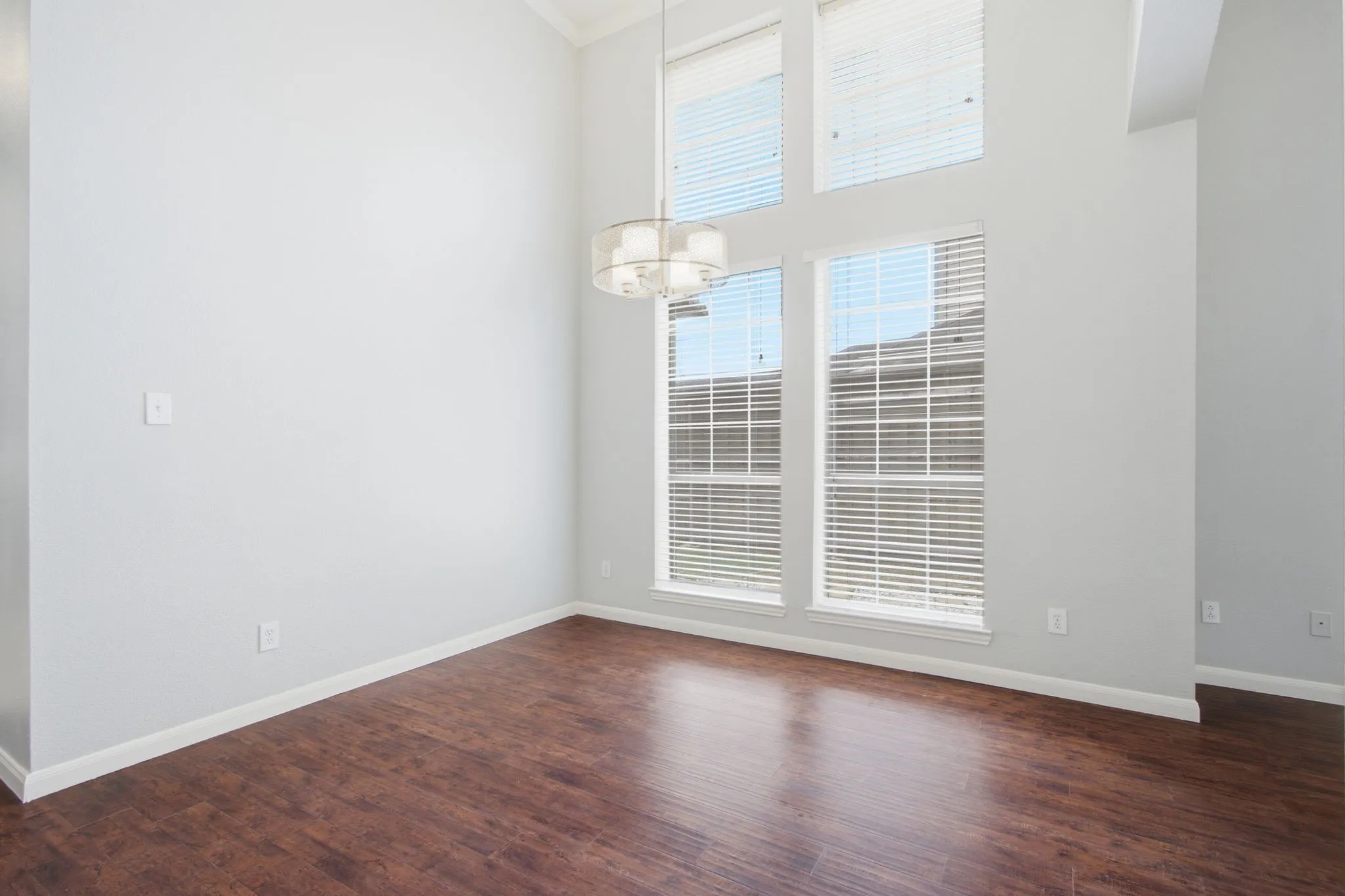 Formal dining room with wall of windows.