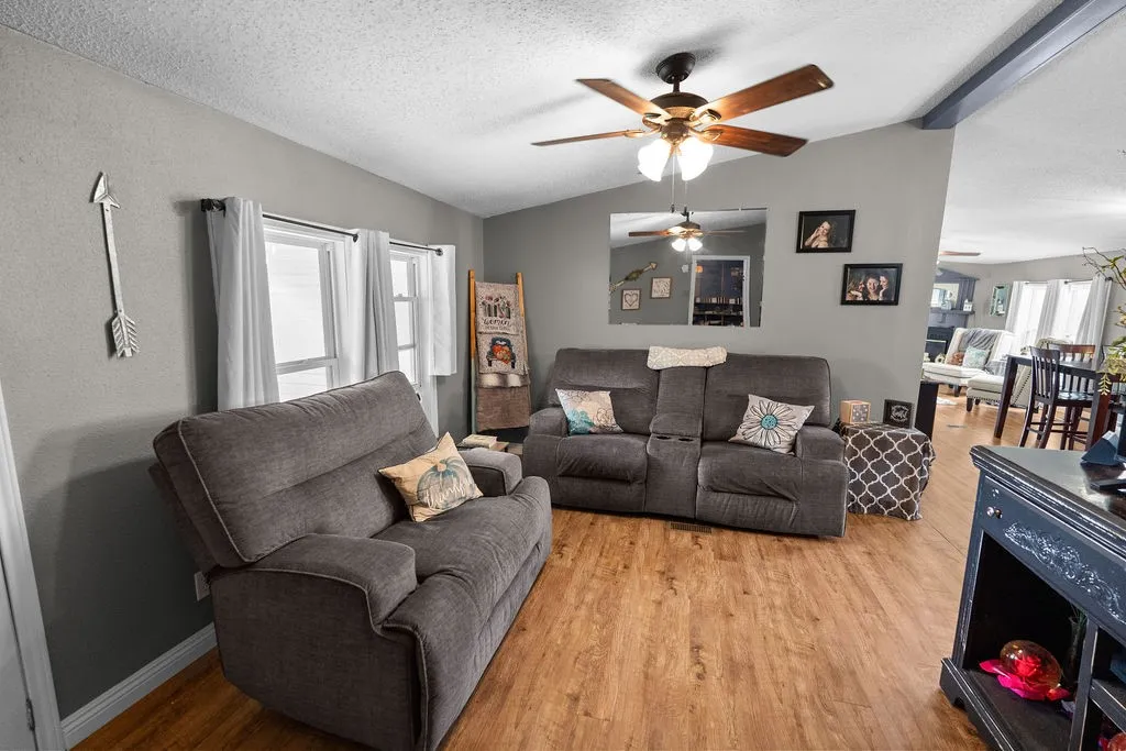 On entry, you are greeted by this cozy living room, with plenty of space for big comfortable furniture